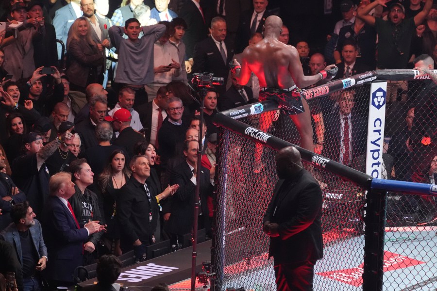 President-elect Donald Trump watches as Jon Jones reacts after defeating Stipe Miocic at UFC 309 at Madison Square Garden, early Sunday, Nov. 17, 2024, in New York. (AP Photo/Evan Vucci)