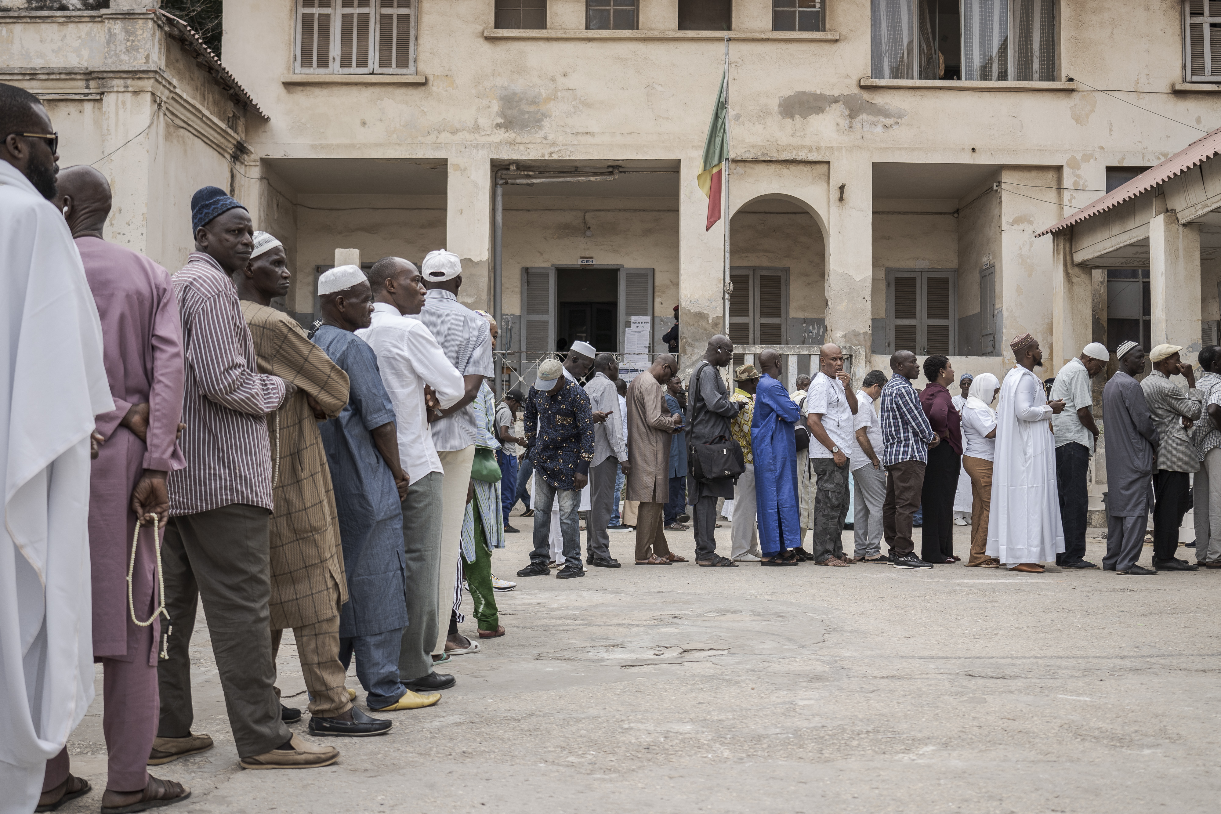 People line up to cast their ballot for legislative elections in Dakar, Senegal, Sunday, Nov. 17, 2024. (AP Photo/Annika Hammerschlag)