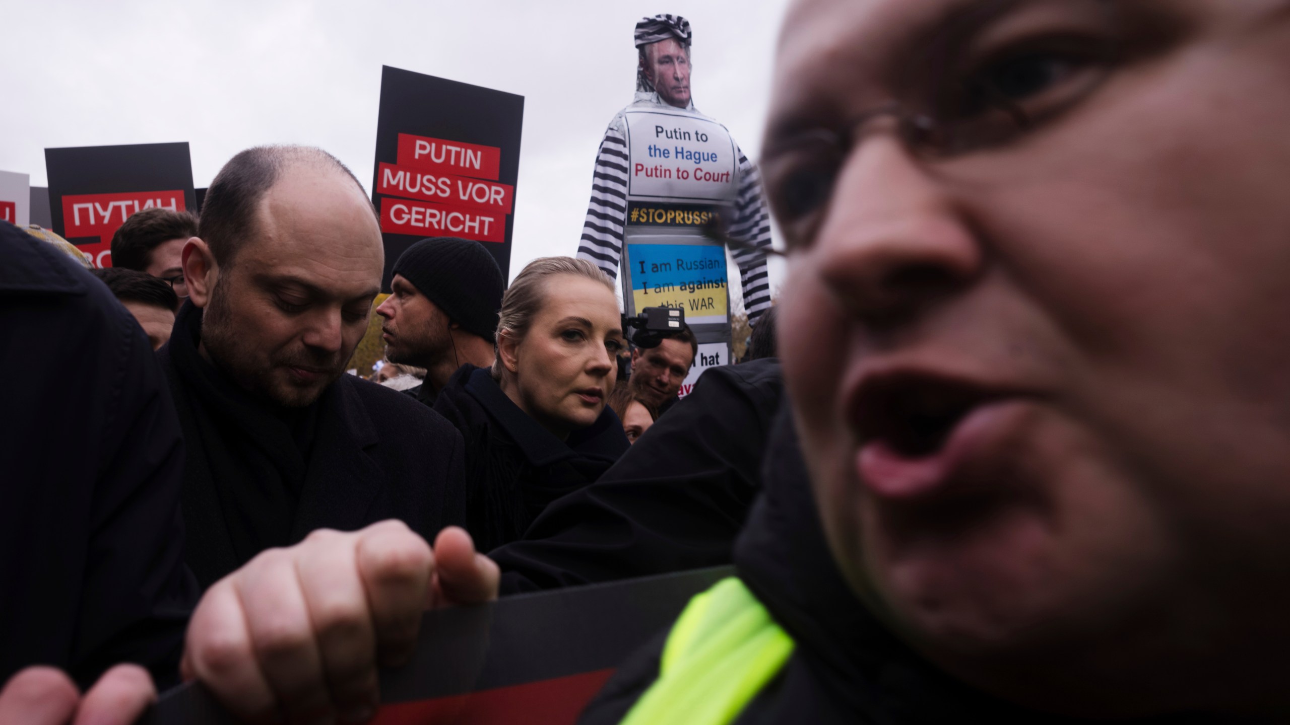 Yulia Navalnaya, center, with Russian opposition politician Vladimir Kara-Murza, left, lead a demonstration under the slogan "Stop Putin! Stop the War! Freedom for Political Prisoners!" in Berlin, Germany, Sunday, Nov. 17, 2024. (AP Photo/Markus Schreiber)