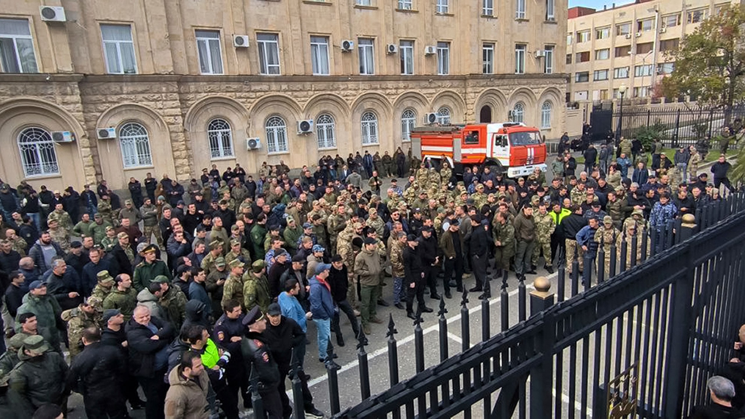 In this photo taken from video released by AIASHARA Independent Agency, Protesters gather outside the parliament building of the Georgian separatist region of Abkhazia as tensions flared over a proposed pact that would allow Russians to buy apartments in the region, Georgia, on Friday, Nov. 15, 2024, (AIASHARA Independent Agency via AP)