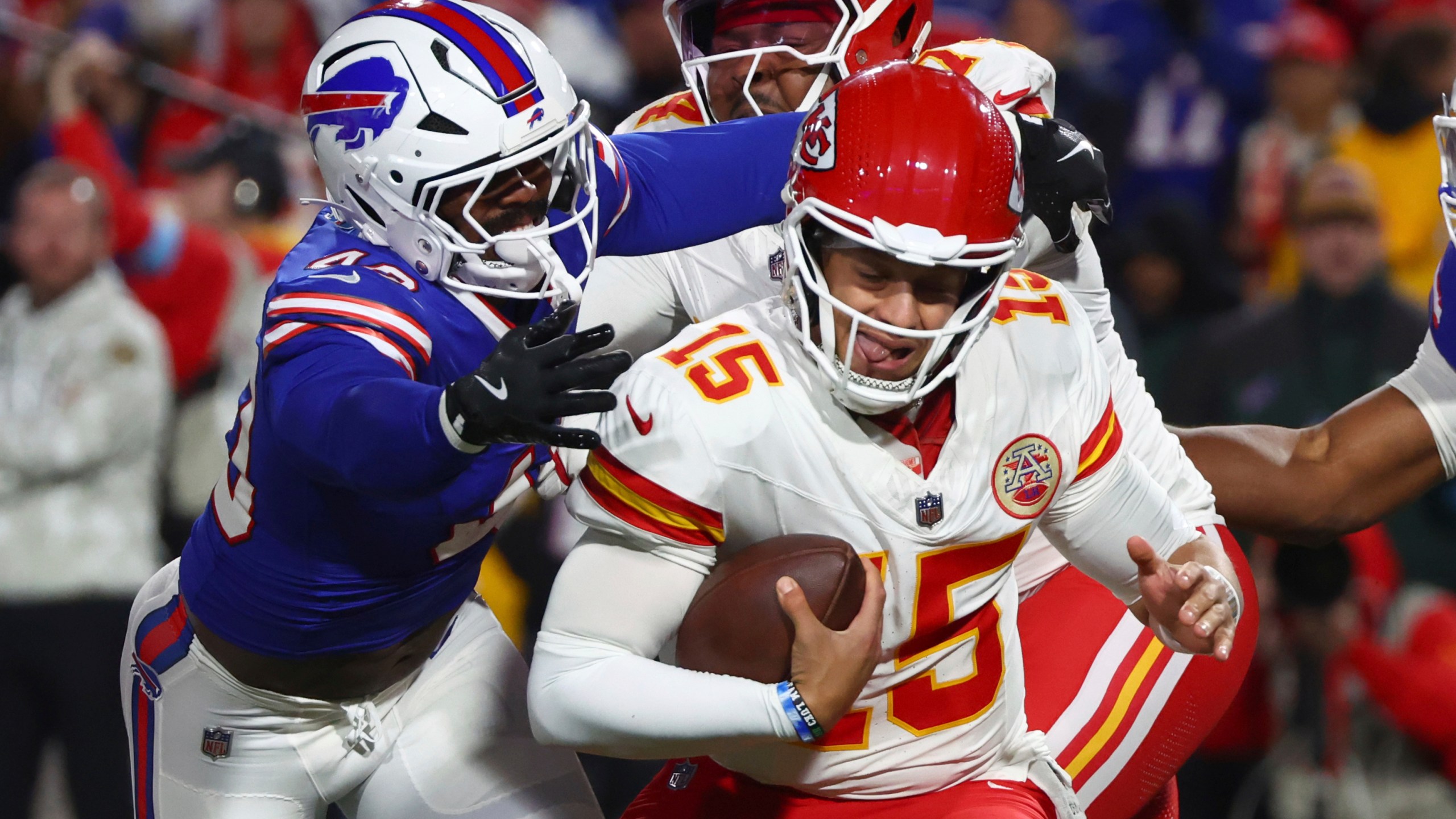 Kansas City Chiefs quarterback Patrick Mahomes (15) is pressured by Buffalo Bills linebacker Von Miller, left, during the first half of an NFL football game Sunday, Nov. 17, 2024, in Orchard Park, N.Y. (AP Photo/Jeffrey T. Barnes)