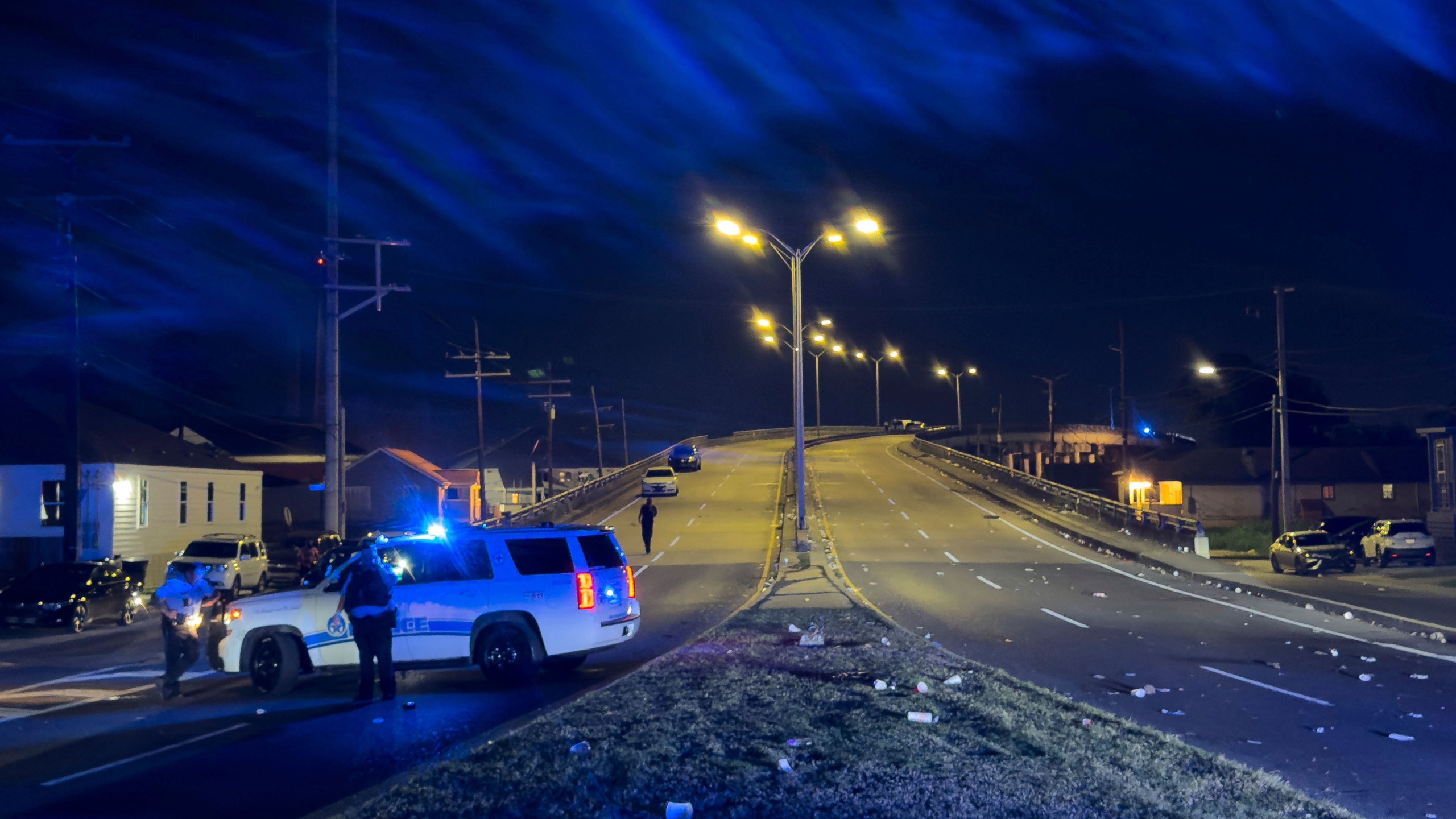 New Orleans Police block the Almonaster Avenue Bridge after a deadly shooting during a second line celebration in New Orleans, Sunday Nov. 17, 2024. (David Grunfeld/The Times-Picayune/The New Orleans Advocate via AP)