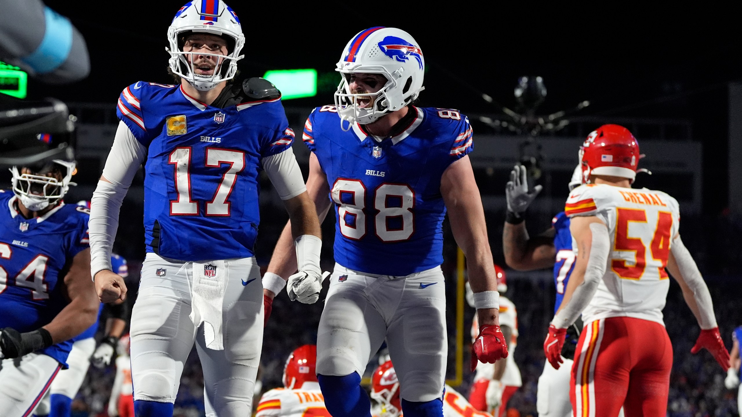 Buffalo Bills quarterback Josh Allen (17) is congratulated by teammate Dawson Knox (88) after scoring on a 26-yard run during the second half of an NFL football game against the Kansas City Chiefs Sunday, Nov. 17, 2024, in Orchard Park, N.Y. (AP Photo/Julia Demaree Nikhinson)