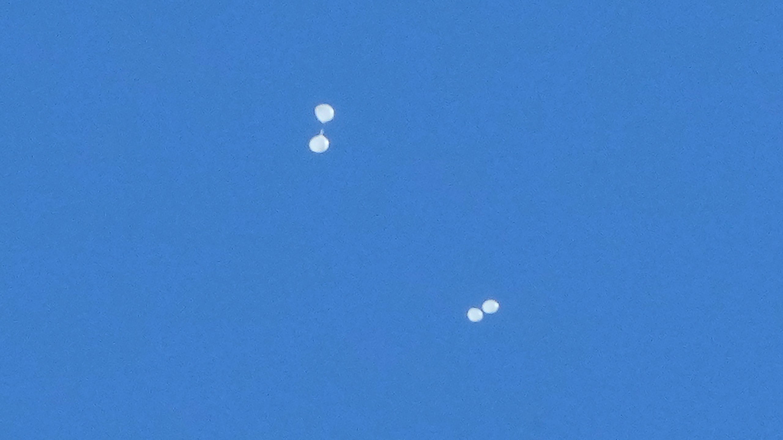 FILE - Balloons carrying what local media reported "trash" are seen in the sky over Seoul, South Korea, on Oct. 2, 2024, as they are also reportedly sent from North Korea. (AP Photo/Ahn Young-joon, File)