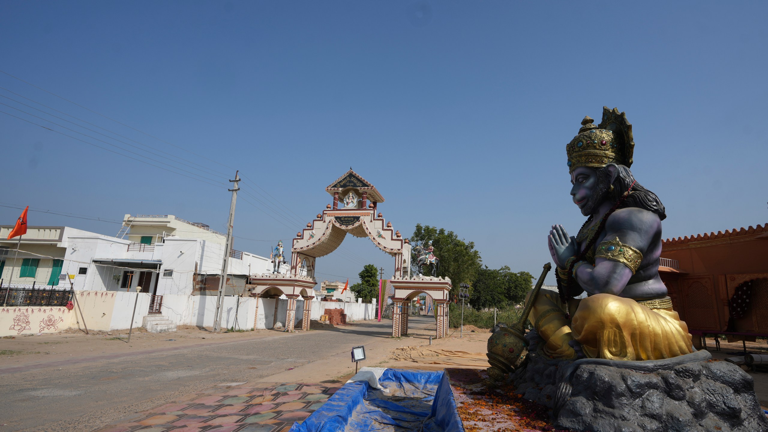 A statue of Monkey God Hanuman, installed as part of a religious celebrations, is seen in front of an entrance gate of Dingucha village in Gandhinagar, India, Tuesday, Nov. 12, 2024. (AP Photo/Ajit Solanki)