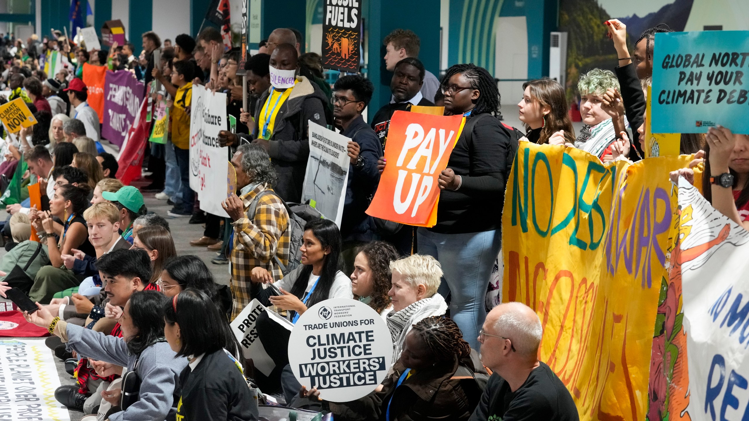 Activists participate in a demonstration at the COP29 U.N. Climate Summit, Saturday, Nov. 16, 2024, in Baku, Azerbaijan. (AP Photo/Rafiq Maqbool)