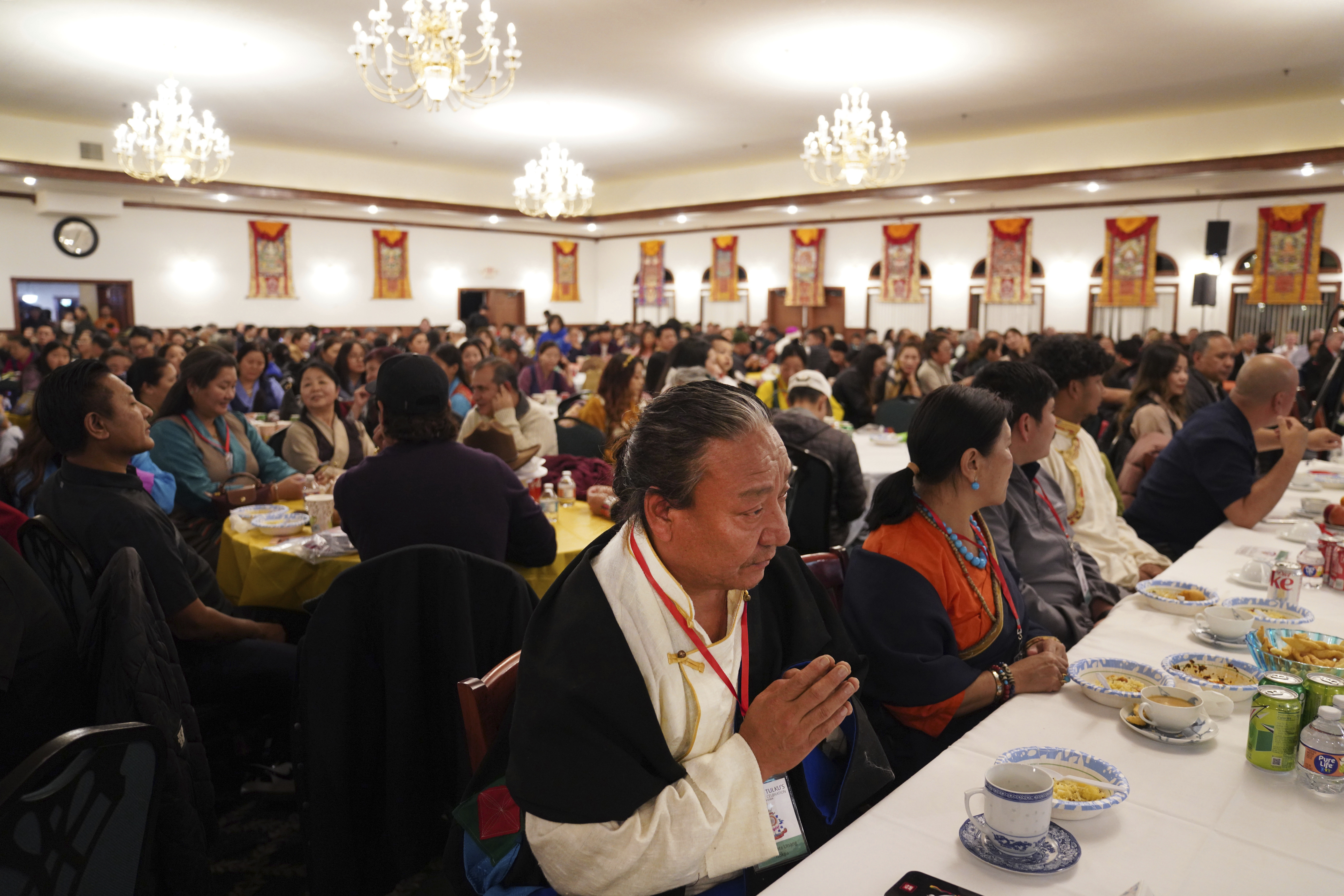 Hundreds attend the 18th birthday and enthronement ceremony for U.S.-born Buddhist lama, Jalue Dorje, at the Tibetan American Foundation of Minnesota in Isanti, Minn., on Saturday, Nov. 9, 2024. (AP Photo/Jessie Wardarski)