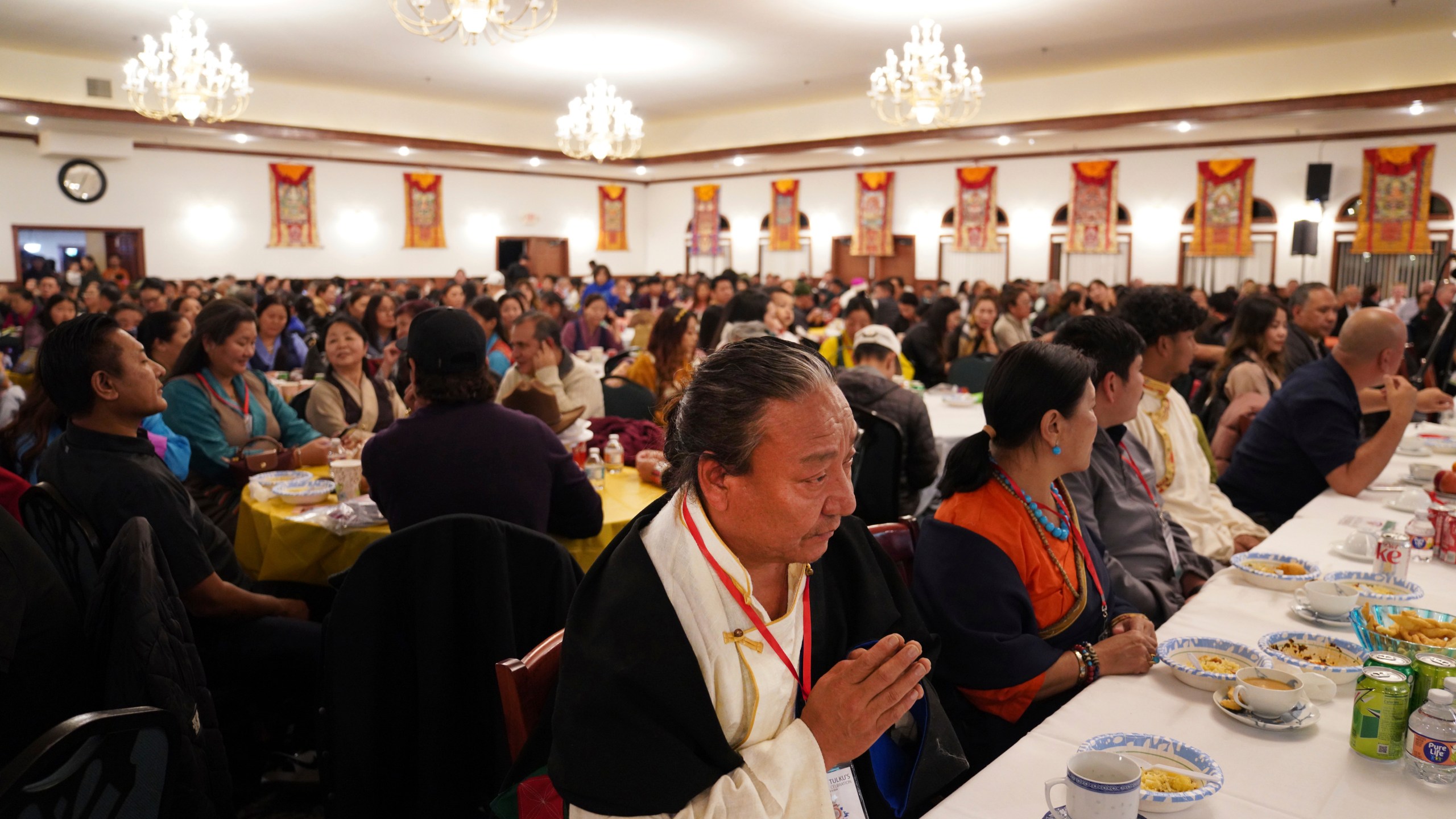 Hundreds attend the 18th birthday and enthronement ceremony for U.S.-born Buddhist lama, Jalue Dorje, at the Tibetan American Foundation of Minnesota in Isanti, Minn., on Saturday, Nov. 9, 2024. (AP Photo/Jessie Wardarski)