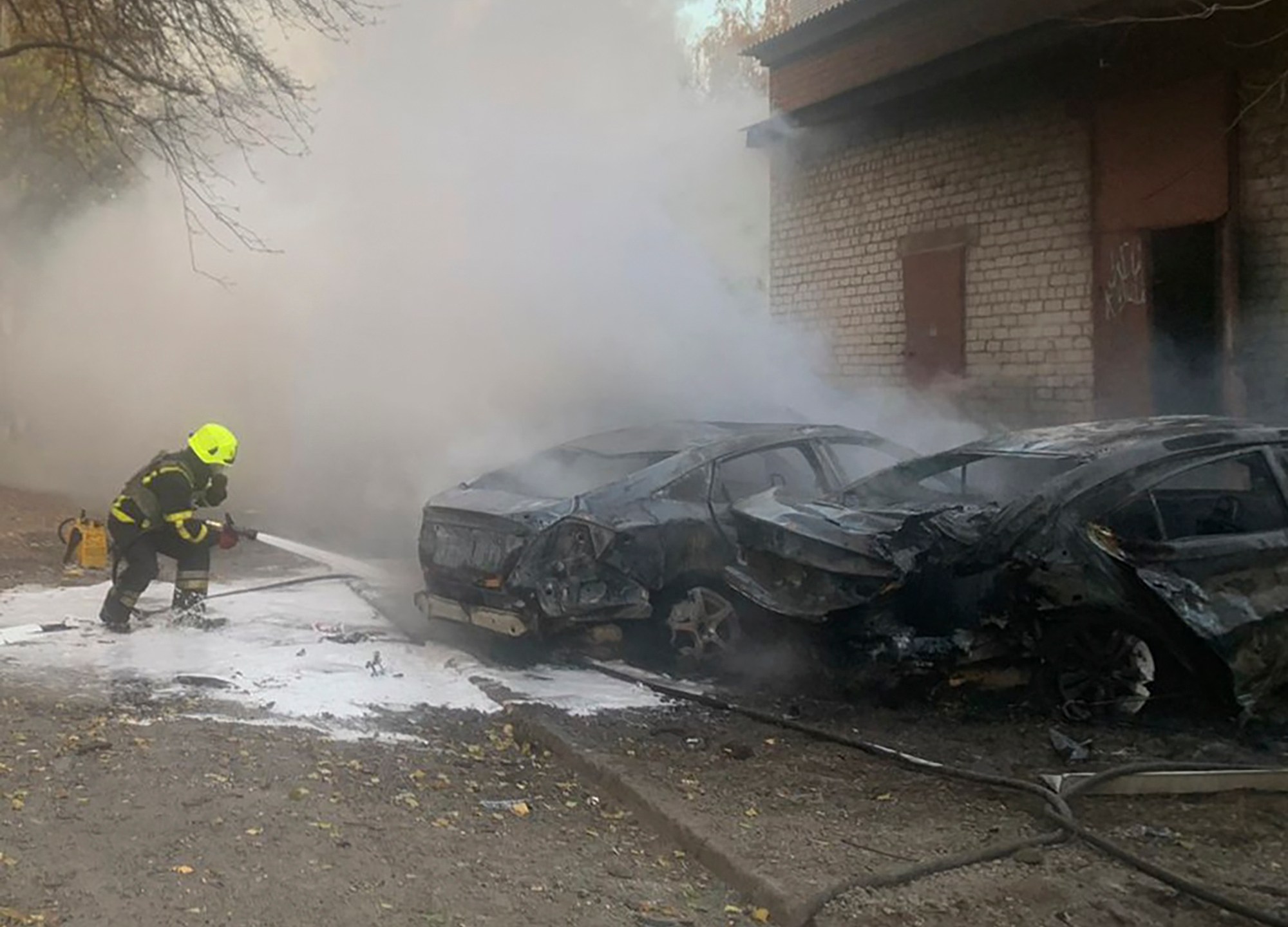 In this photo provided by the Ukrainian Emergency Service, emergency services personnel work to extinguish a fire following a Russian rocket attack in Poltava region, Ukraine, Sunday, Nov. 17, 2024. (Ukrainian Emergency Service via AP)