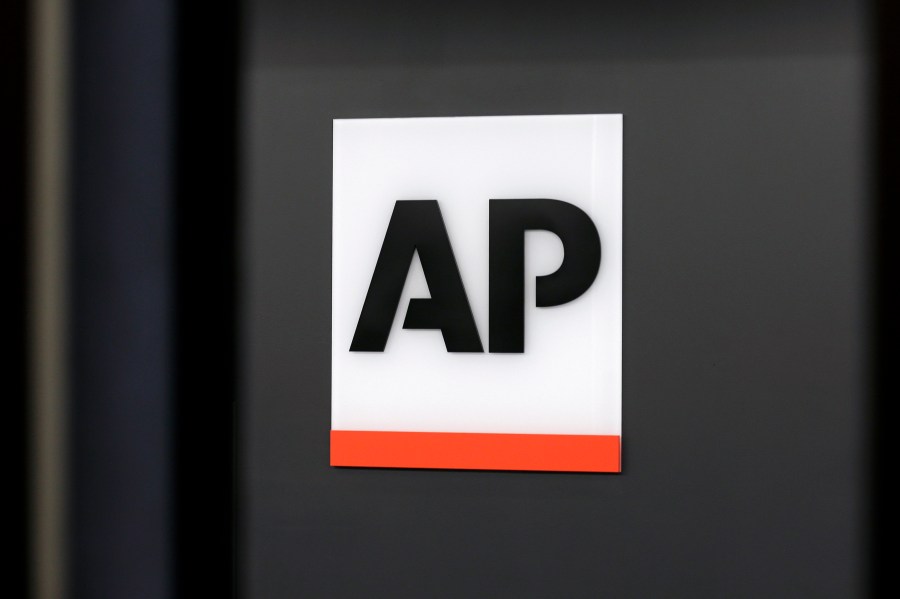 FILE - The Associated Press logo is displayed at the company's headquarters on April 18, 2017, in New York. (AP Photo/Jenny Kane, File)