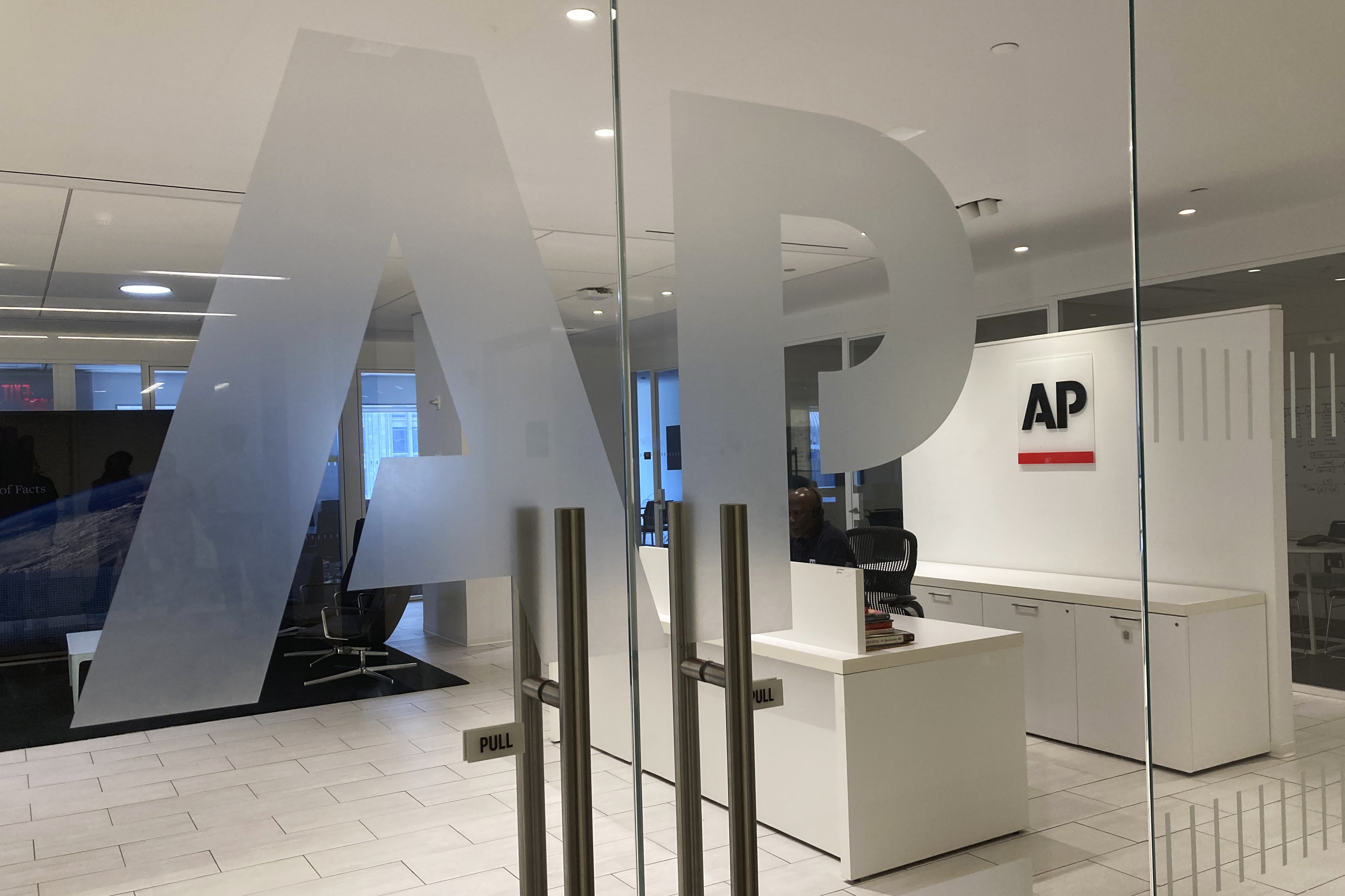 FILE - The Associated Press logo is shown at the entrance to the news organization's office in New York on Thursday, July 13, 2023. (AP Photo/Aaron Jackson, File)