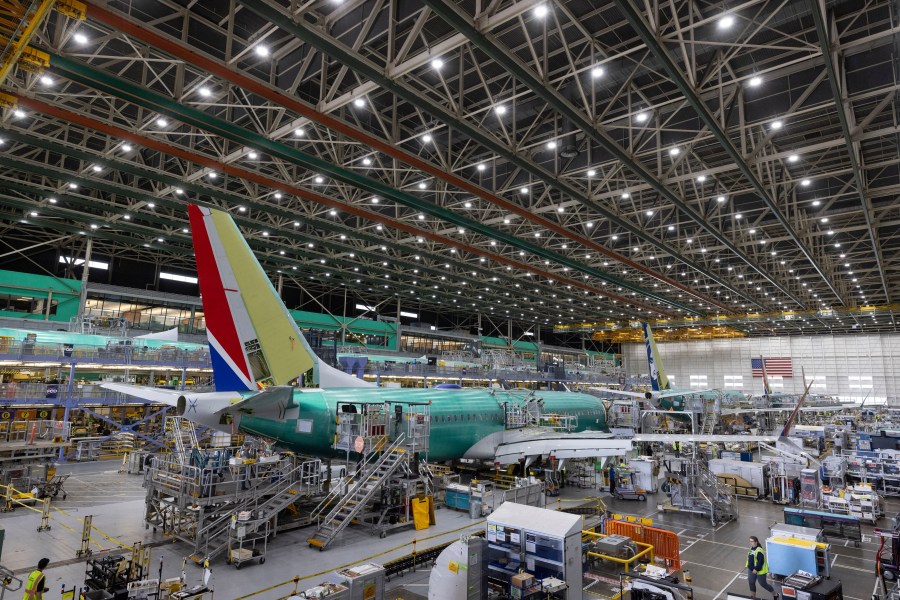 FILE - Boeing employees work on the 737 MAX on the final assembly line at Boeing's Renton plant, June 15, 2022, in Renton, Wash. (Ellen M. Banner/The Seattle Times via AP, Pool, File)