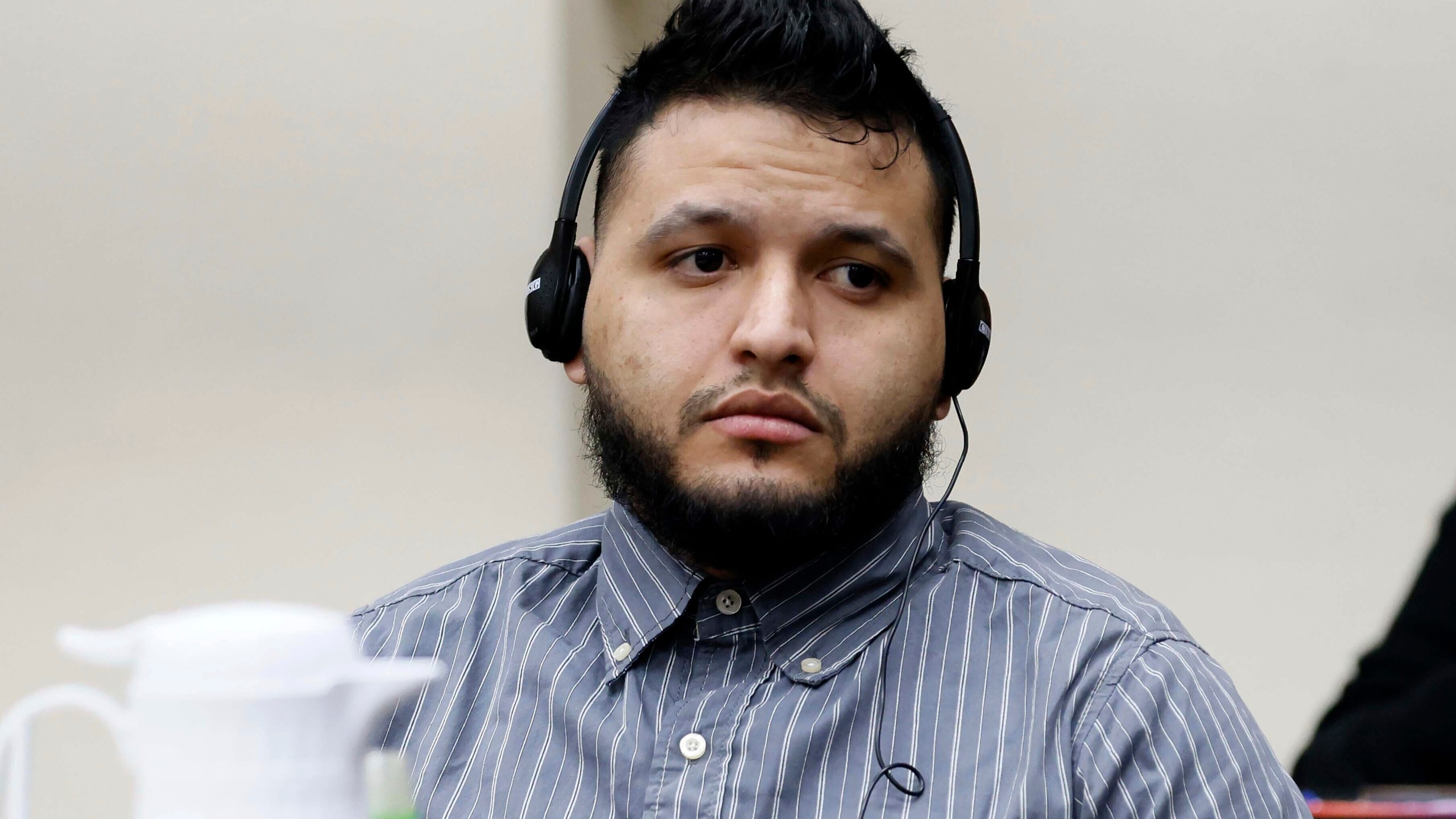 Jose Ibarra listens through an interpreter during the second day of his trial at the Athens-Clarke County Superior Court on Monday, Nov. 18, 2024, in Athens, Ga. (Miguel Martinez/Atlanta Journal-Constitution via AP, Pool)