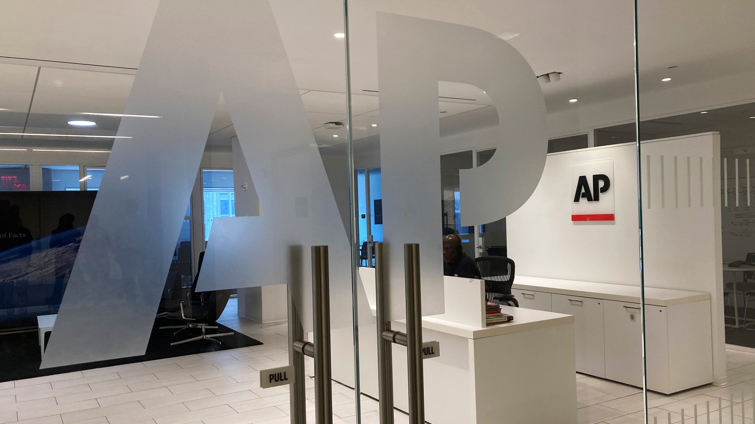 FILE - The Associated Press logo is shown at the entrance to the news organization's office in New York on Thursday, July 13, 2023. (AP Photo/Aaron Jackson, File)