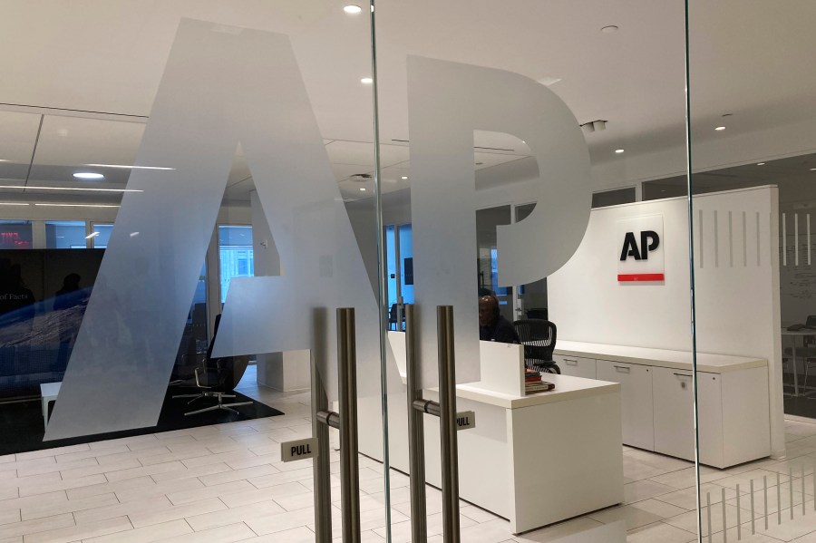 FILE - The Associated Press logo is shown at the entrance to the news organization's office in New York on Thursday, July 13, 2023. (AP Photo/Aaron Jackson, File)