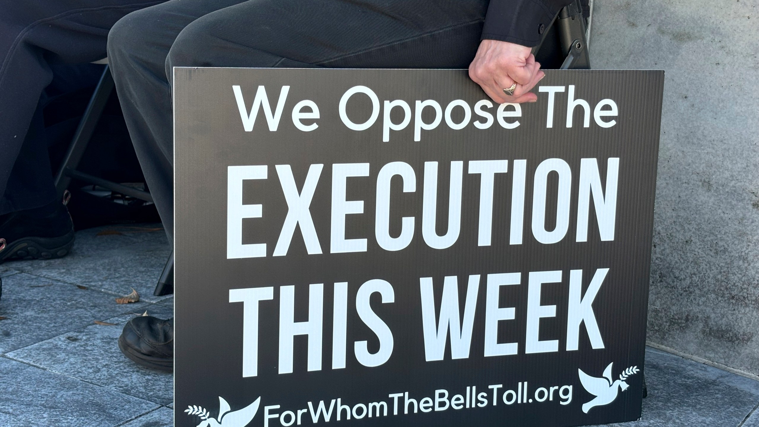 A demonstrator holds a sign during a protest outside the Capitol in Montgomery, Ala., on Monday, Nov. 18, 2024, against a scheduled execution in Alabama using nitrogen gas. (Kim Chandler/Associated Press)