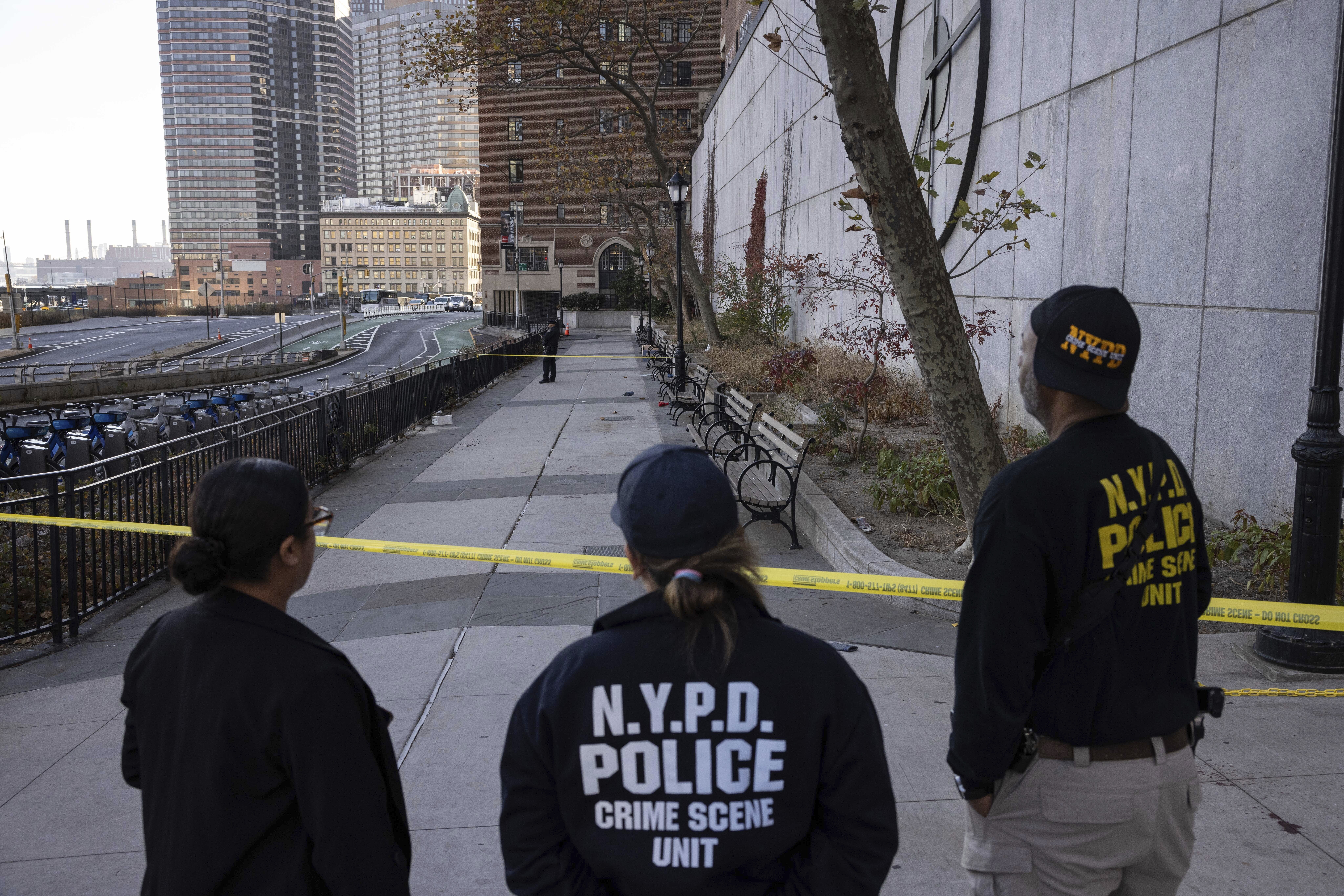 NYPD officers stand at the site of stabbing spree near the United Nations Headquarters in New York, Monday, Nov. 18, 2024. (AP Photo/Yuki Iwamura)