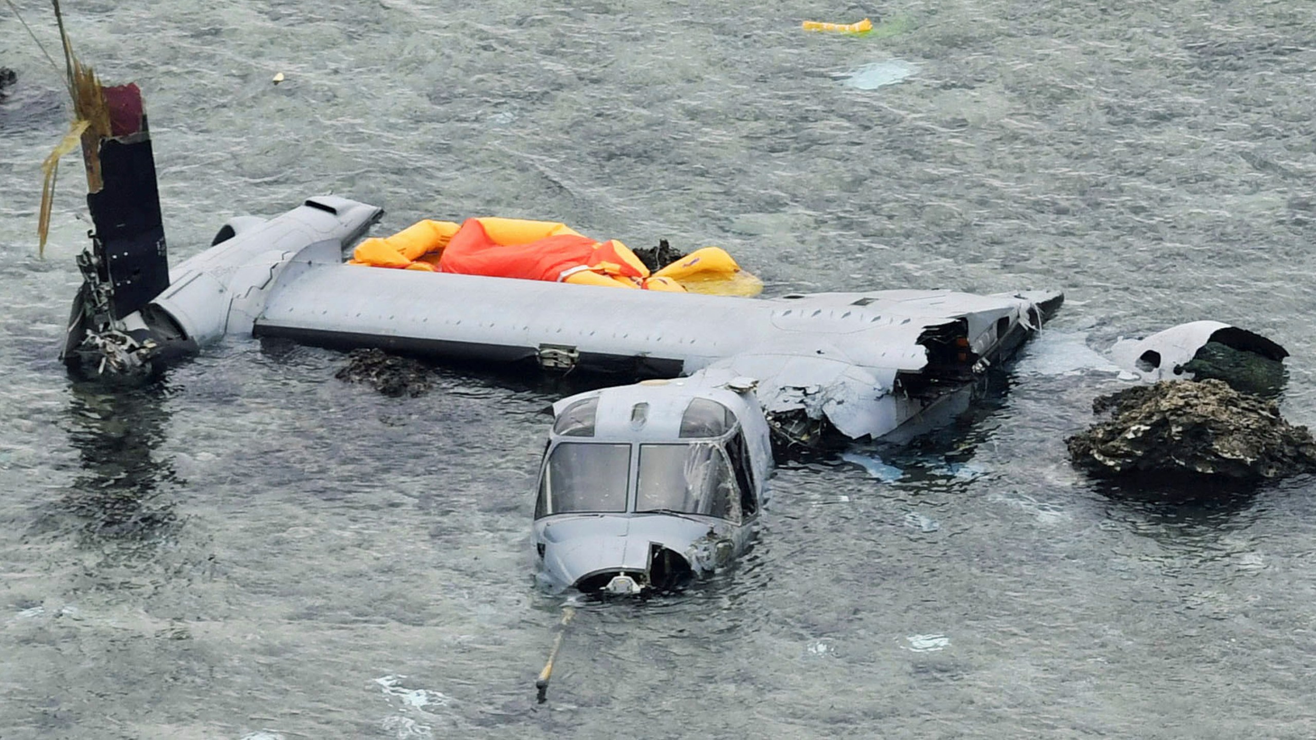 FILE - Wreckage of a U.S. military MV-22 Osprey is seen in shallow waters off Nago, Okinawa, southern Japan, Dec. 14, 2016, after it crash landed. (Yu Nakajima/Kyodo News via AP, File)