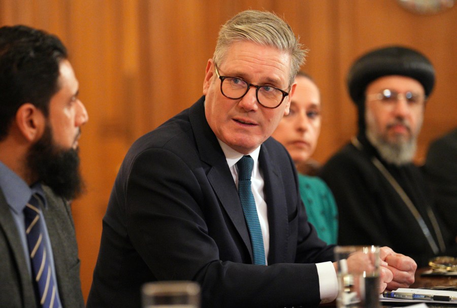 Britain's Prime Minister, Keir Starmer, center, speaks with religious leaders during a breakfast roundtable meeting for faith leaders as part of Inter Faith Week at 10 Downing Street, in London, Thursday, Nov. 14, 2024. (Carl Court/Pool Photo via AP)