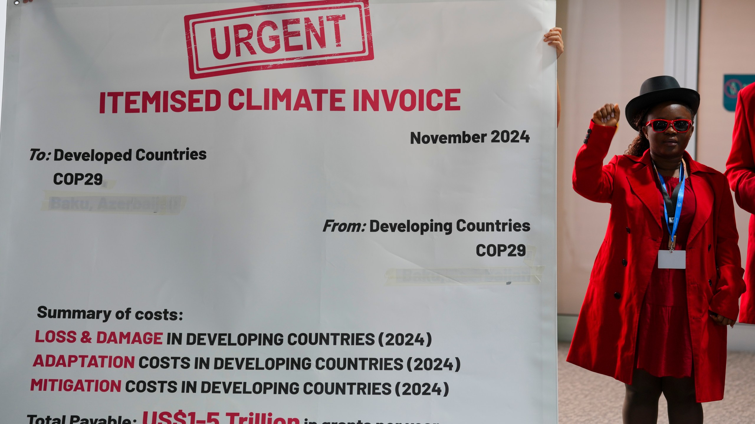 Activists participate in a demonstration for climate finance at the COP29 U.N. Climate Summit, Tuesday, Nov. 19, 2024, in Baku, Azerbaijan. (AP Photo/Peter Dejong)