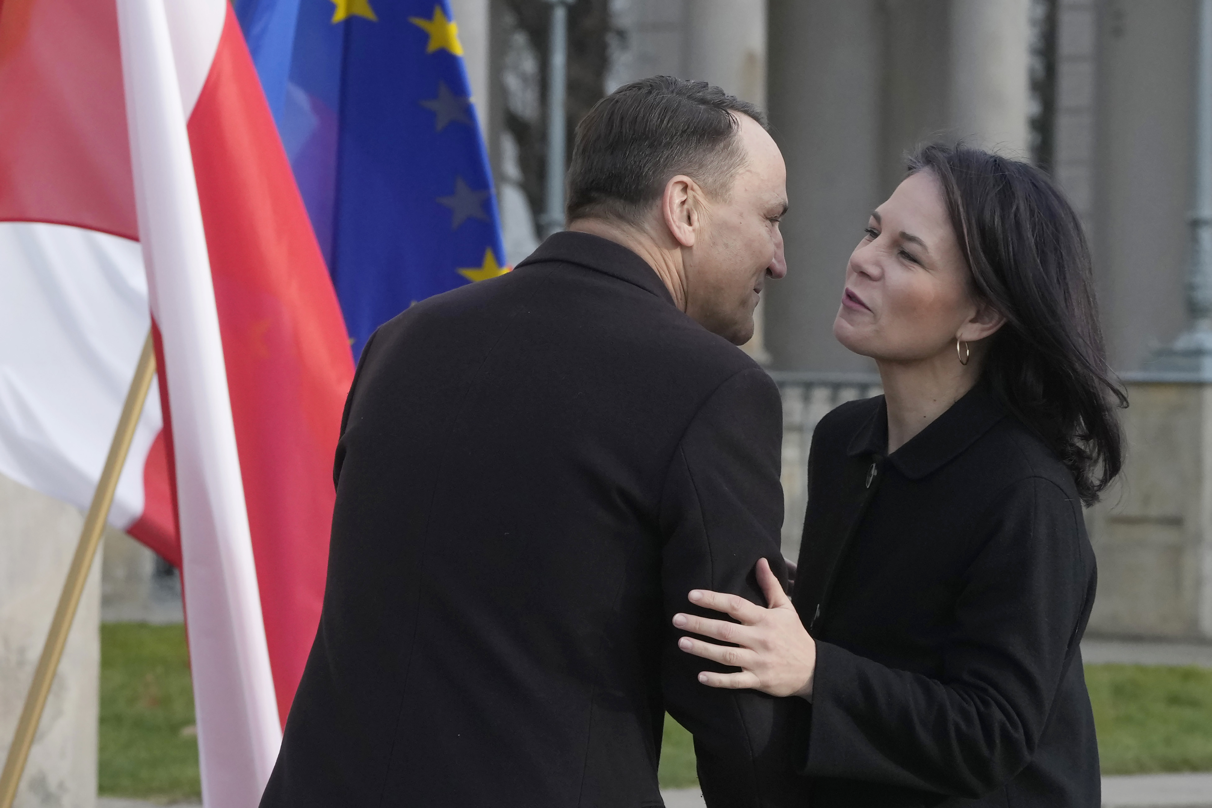 Germany's Foreign Minister Annalena Baerbock, right, is greeted by Poland's Foreign Minister Radoslaw Sikorski, upon her arrival for a meeting of European foreign ministers, in Warsaw, Tuesday, Nov. 19, 2024. (AP Photo/Czarek Sokolowski)