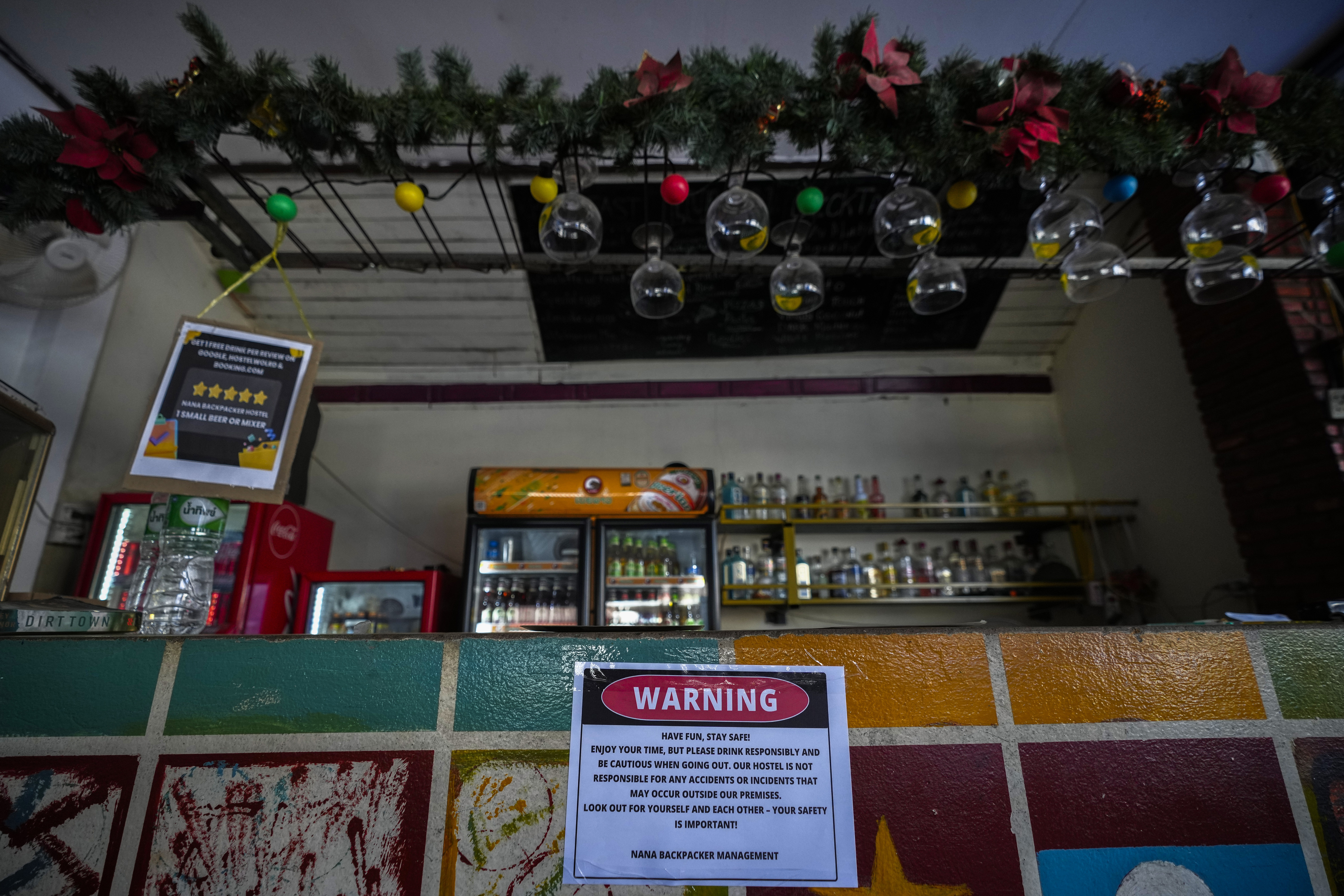 A notice displayed at the bar of Nana Backpack hostel in Vang Vieng, Laos, Tuesday, Nov. 19, 2024. (AP Photo/Anupam Nath)