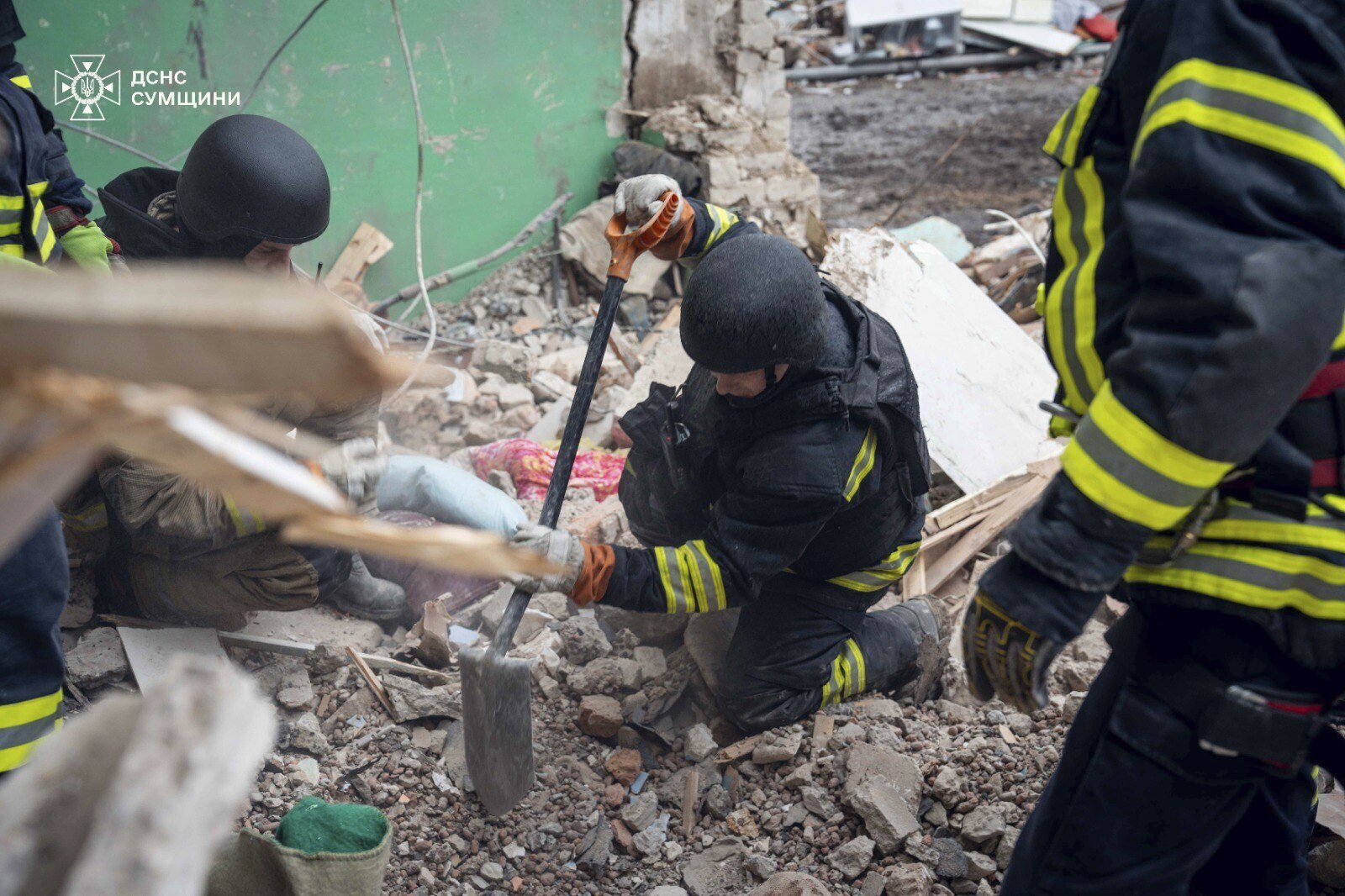 In this photo provided by the Ukrainian Emergency Services on Nov. 19, 2024, rescue workers clear the rubble of a residential building destroyed by a Russian strike in Hlukhiv, Ukraine. (Ukrainian Emergency Service via AP)