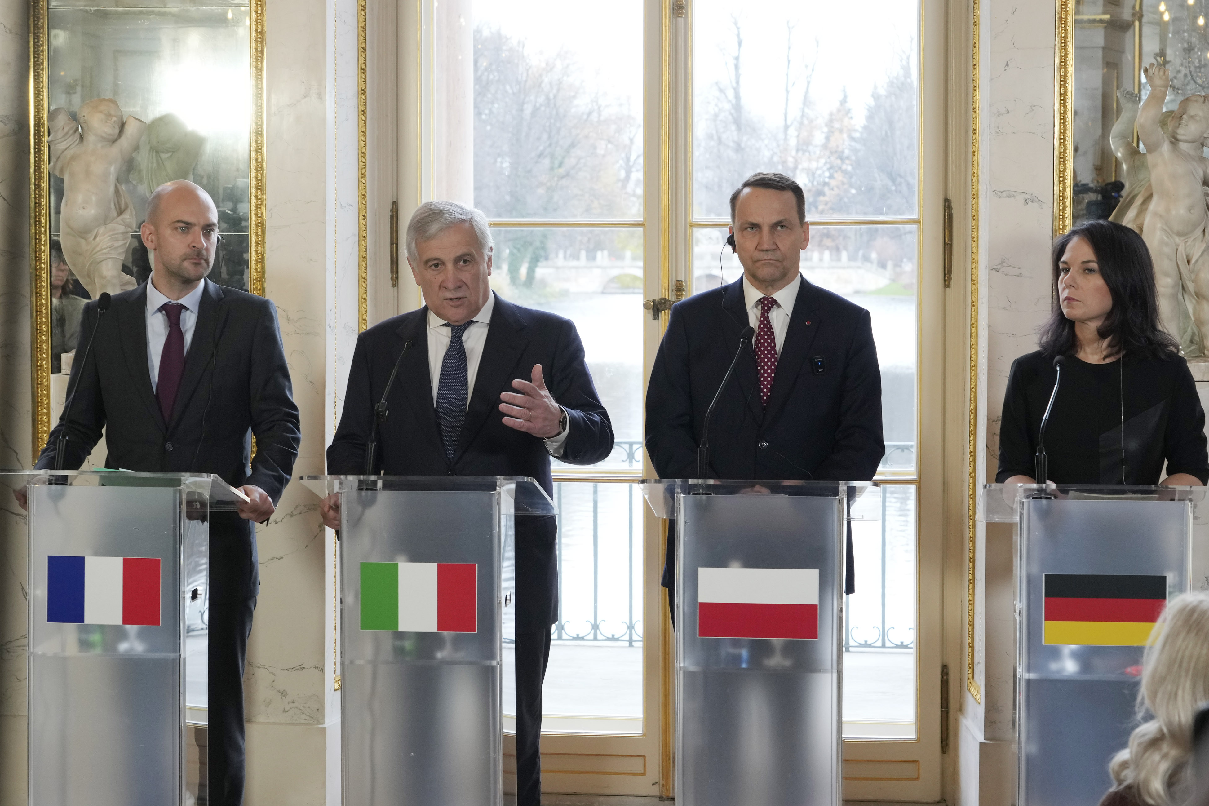 French Minister for Europe and Foreign Affairs Jean-Noel Barrot, left, Italian Foreign Minister Antonio Tajani, second left, Polish Foreign Minister Radoslaw Sikorski and German Foreign Minister Annalena Baerbock, right, attend a press conference as European foreign ministers meet in Warsaw, Poland, Tuesday, Nov. 19, 2024. (AP Photo/Czarek Sokolowski)