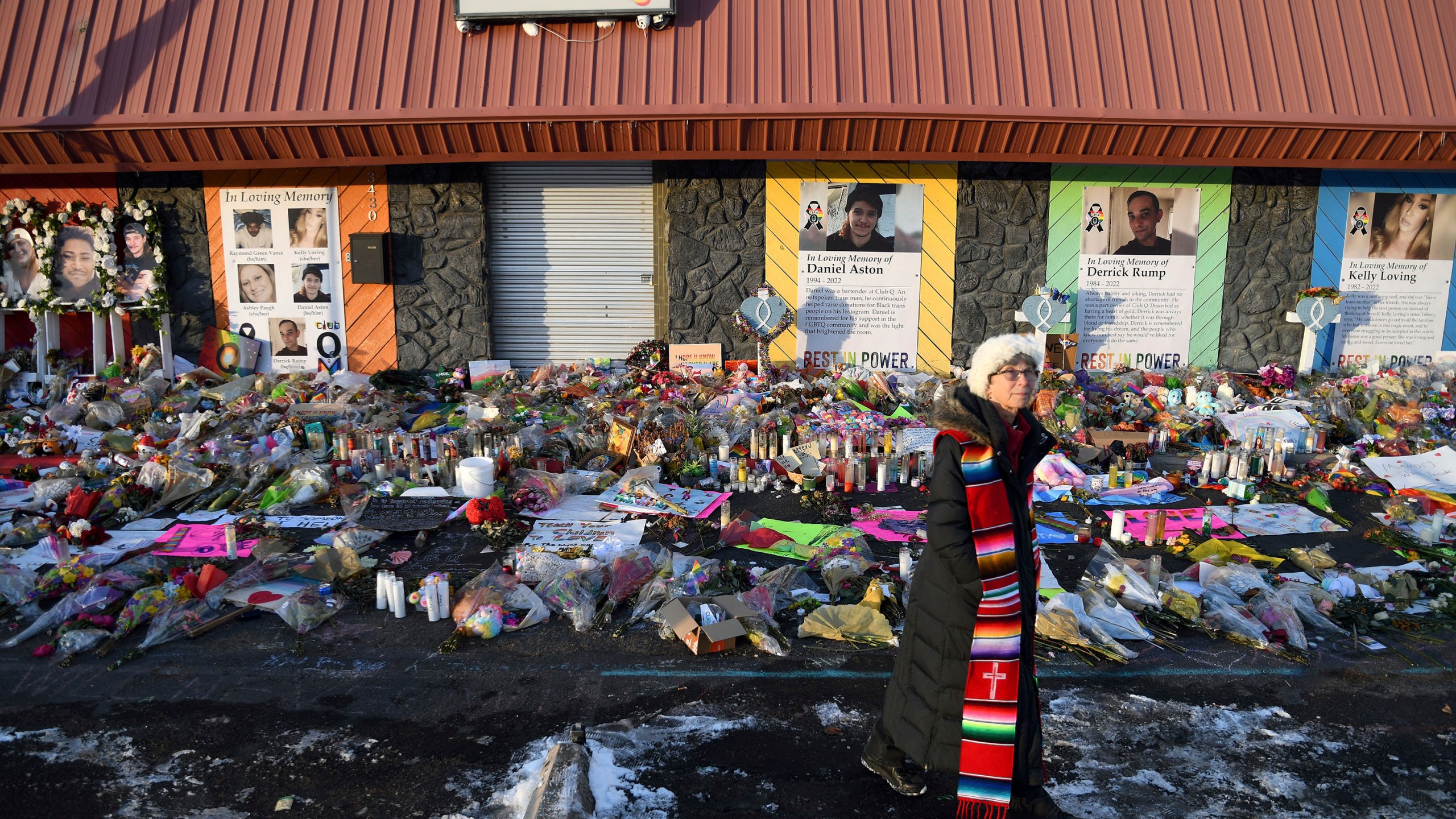 FILE - Rev. Paula Stecker of the Christ the King Lutheran Church stands in front of a memorial set up outside Club Q following a mass shooting at the gay nightclub in Colorado Springs, Colo., Nov. 29, 2022. (AP Photo/Thomas Peipert, File)