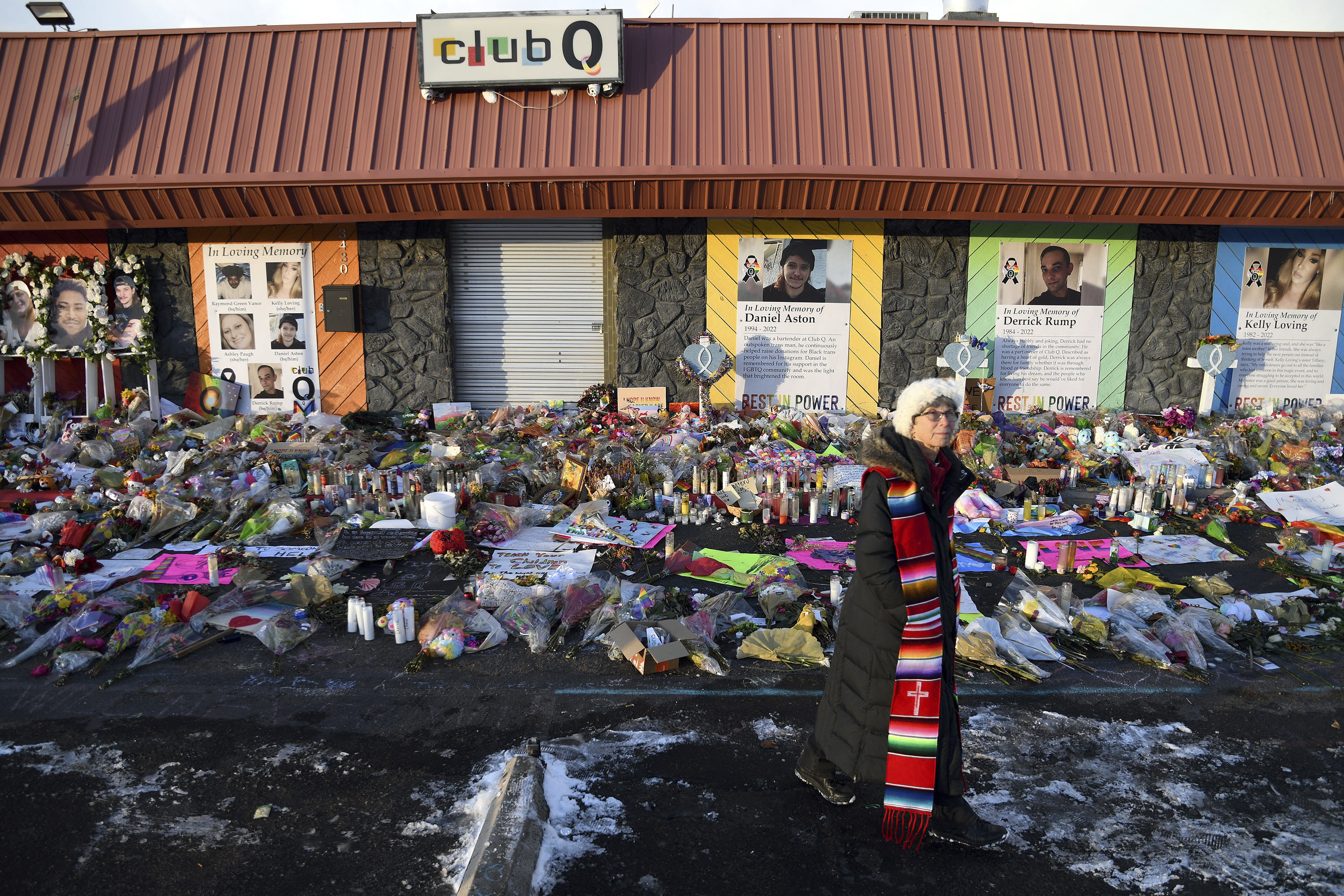 FILE - Rev. Paula Stecker of the Christ the King Lutheran Church stands in front of a memorial set up outside Club Q following a mass shooting at the gay nightclub in Colorado Springs, Colo., Nov. 29, 2022. (AP Photo/Thomas Peipert, File)