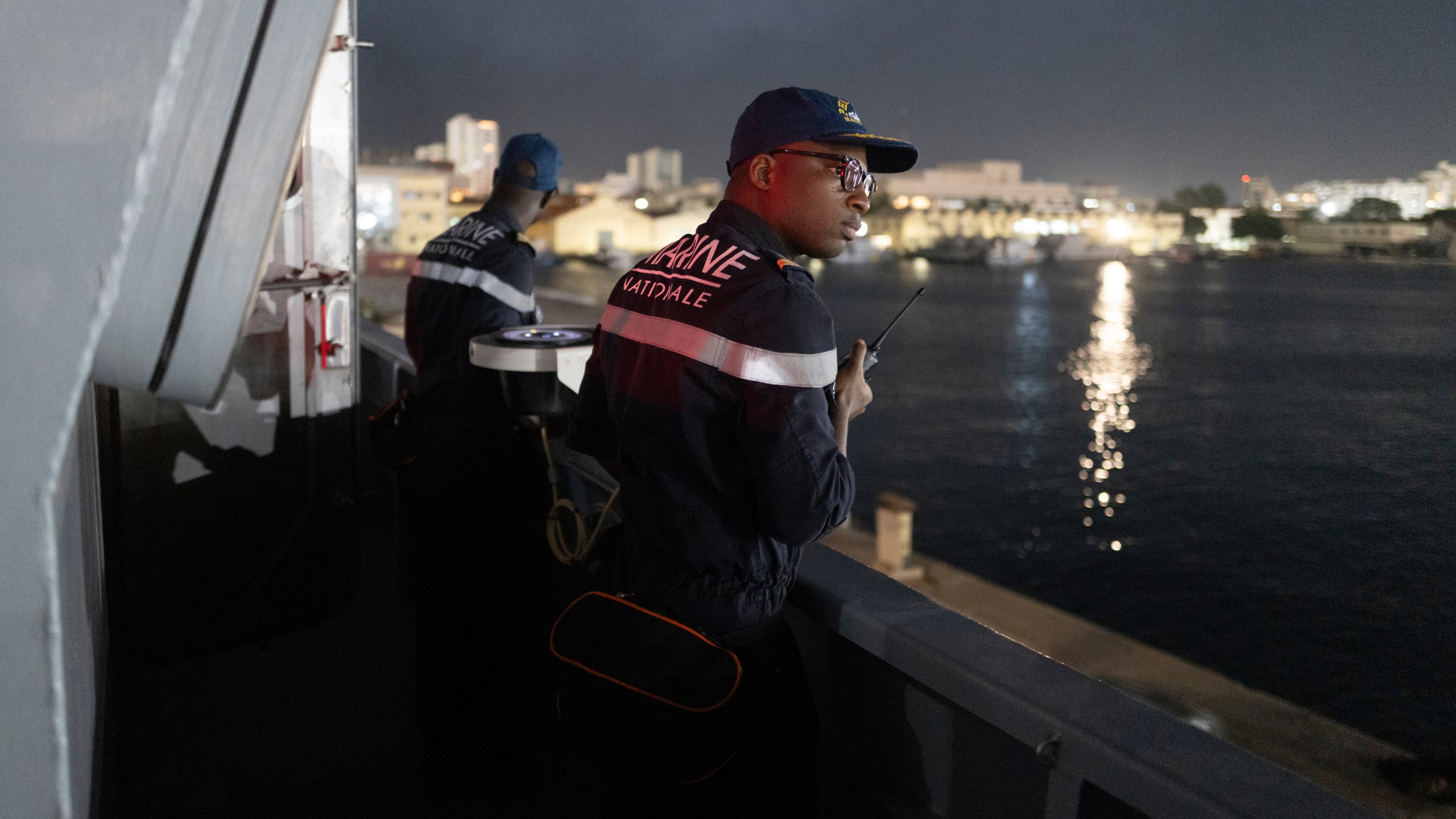 Senegalese sailors on the patrol vessel Niani attend a mission to search for migrant boats near the coast of Dakar, Senegal, Saturday, Nov.16, 2024. (AP Photo/Sylvain Cherkaoui)