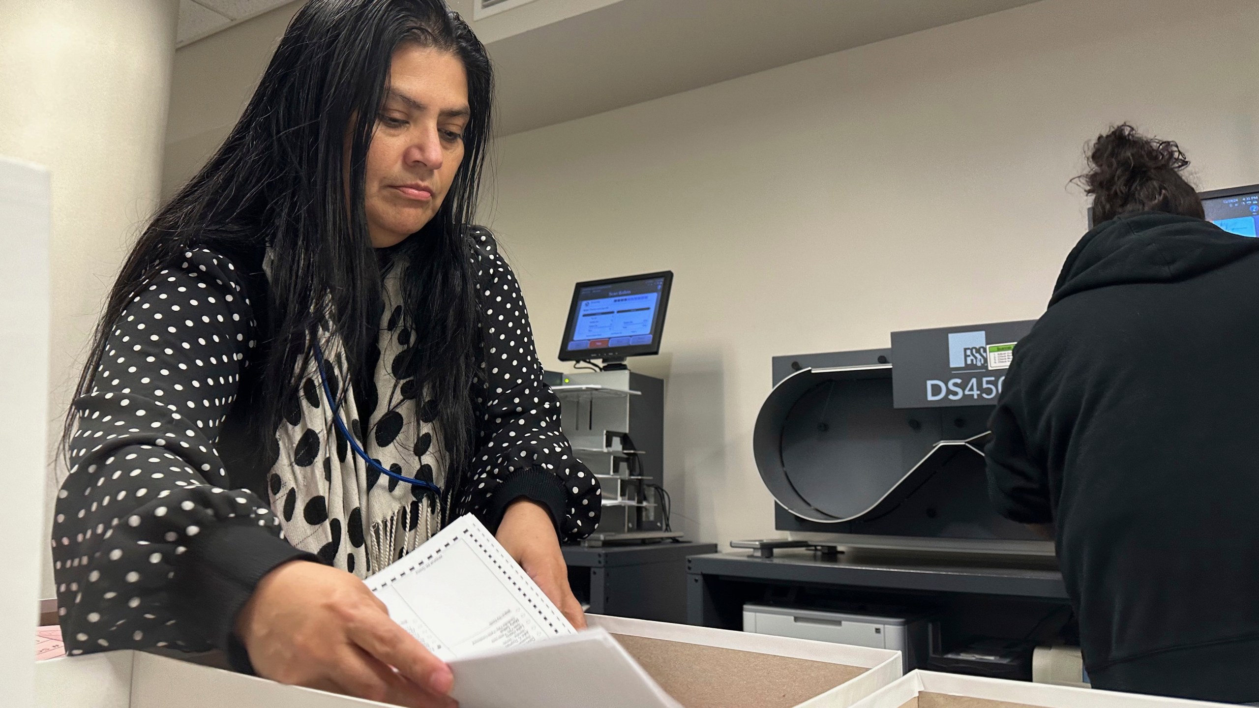 Jessica Cabrera works with a stack of ballots during a state-mandated recount of the U.S. Senate race at the Lehigh County Government Center in Allentown, Pa., Tuesday, Nov. 19, 2024. (AP Photo/Michael Rubinkam)