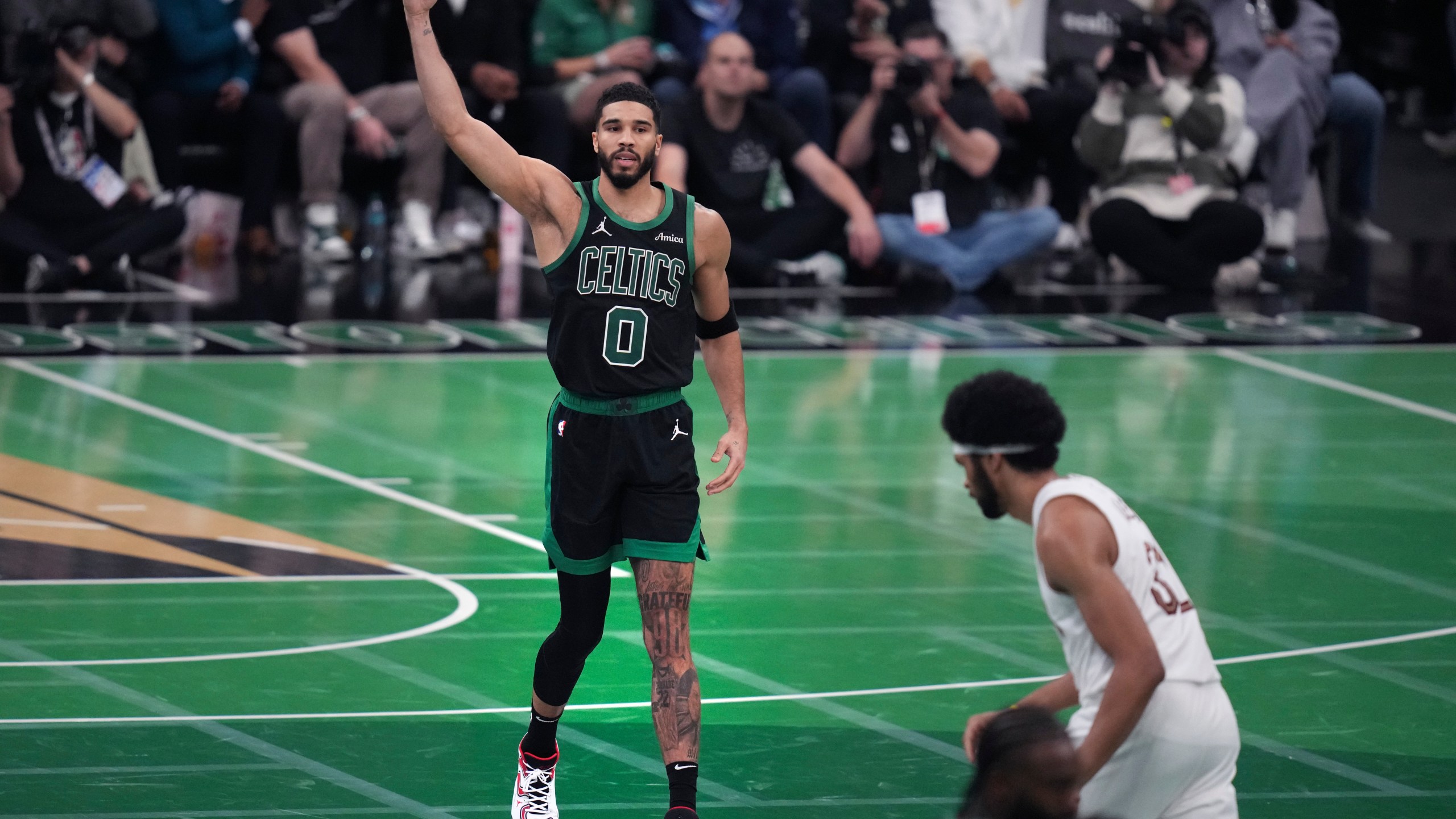 Boston Celtics forward Jayson Tatum (0) celebrates after hitting a 3-pointer during the second half of an Emirates NBA Cup basketball game against the Cleveland Cavaliers, Tuesday, Nov. 19, 2024, in Boston. (AP Photo/Charles Krupa)