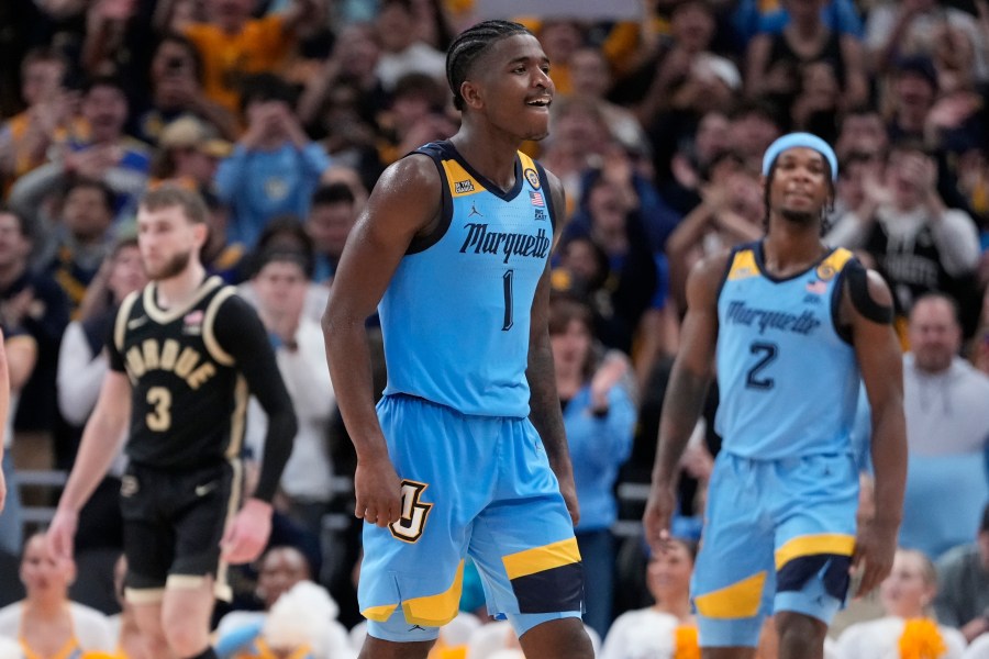 Marquette's Kam Jones reacts during the second half of an NCAA college basketball game against Purdue Tuesday, Nov. 19, 2024, in Milwaukee. Marquette won 76-58. (AP Photo/Morry Gash)