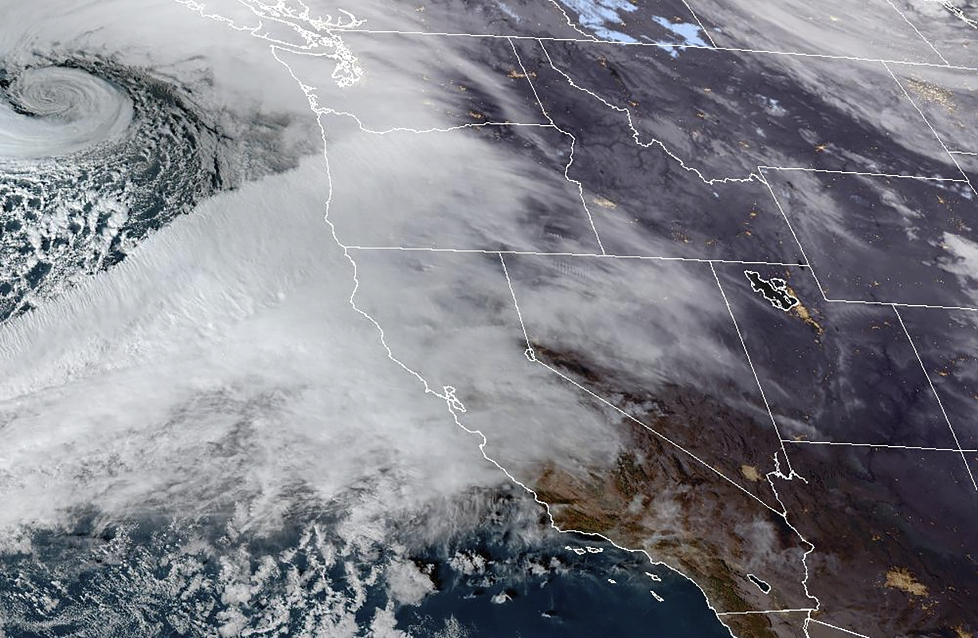 This Nov. 19, 2024 satellite image provided by the National Oceanic and Atmospheric Administration shows an atmospheric river moving in on Northern California and the Pacific Northwest. (NOAA via AP)