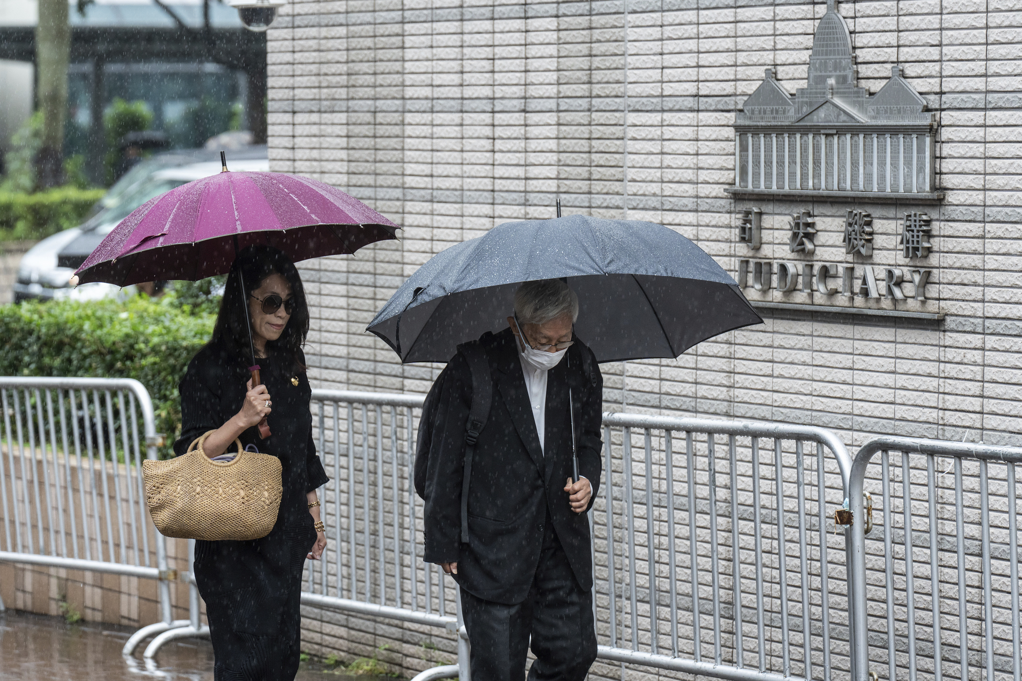 Jimmy Lai's wife Teresa Lai, left, and retired Chinese cardinal Joseph Zen Ze-Kiun arrive at West Kowloon Magistrates' Courts to attend Hong Kong activist publisher Lai's national security trial in Hong Kong, Wednesday, Nov. 20, 2024. (AP Photo/Chan Long Hei)