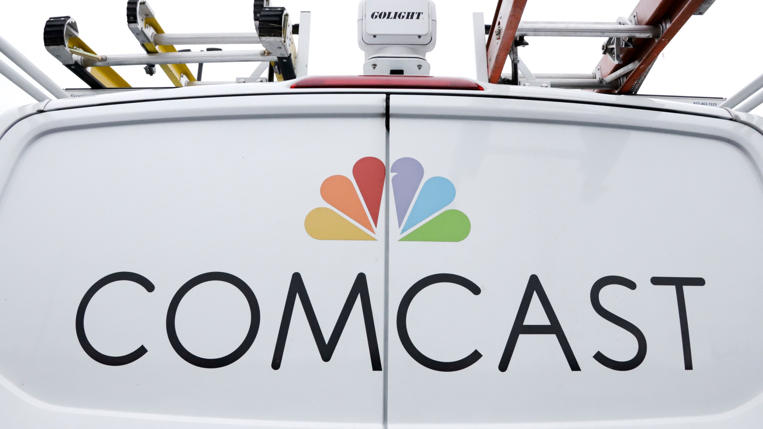 FILE- A Comcast truck is shown on Jan. 24, 2019, in Pittsburgh. (AP Photo/Gene J. Puskar, File)