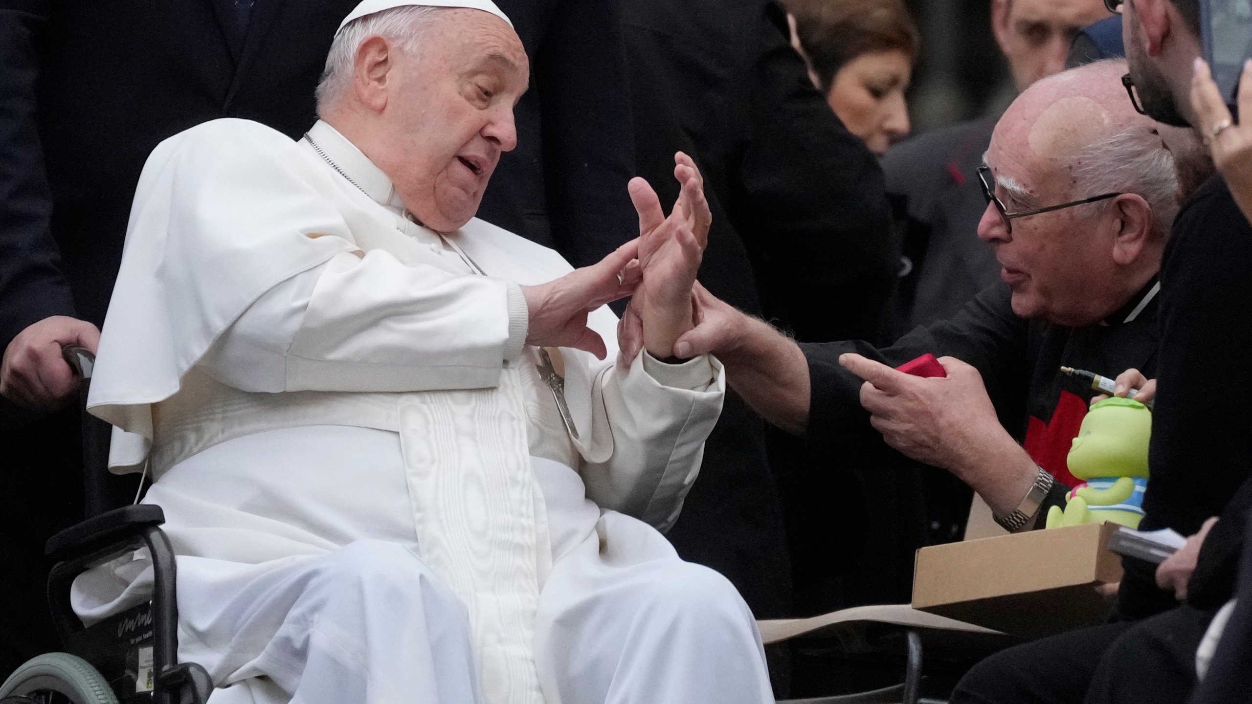 Pope Francis greets faithful during his weekly general audience in St. Peter's Square at The Vatican, Wednesday, Nov.20, 2024. (AP Photo/Gregorio Borgia)