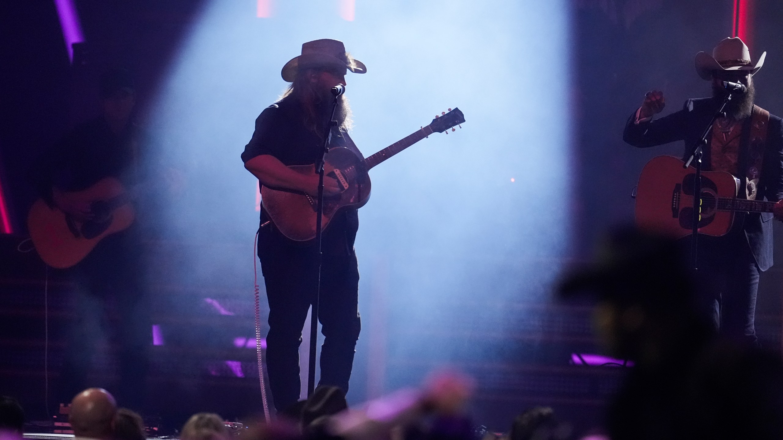 Chris Stapleton, left, and Post Malone perform "California Sober" during the 58th Annual CMA Awards on Wednesday, Nov. 20, 2024, at Bridgestone Arena in Nashville, Tenn. (AP Photo/George Walker IV)