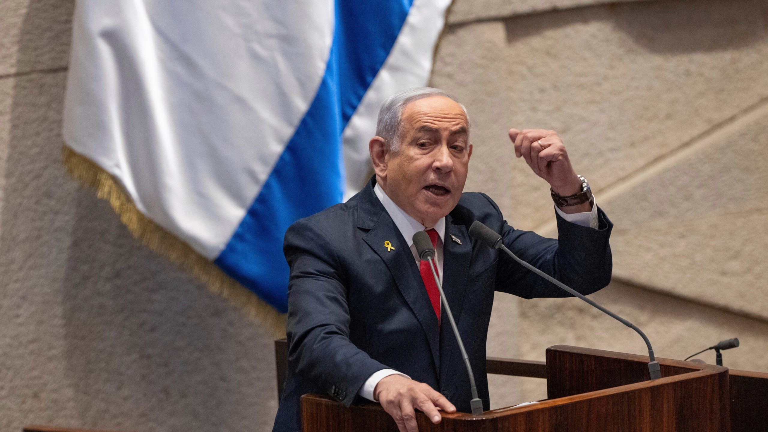 Israel's Prime Minister Benjamin Netanyahu addresses lawmakers in the Knesset, Israel's parliament, in Jerusalem. Monday Nov. 18, 2024. (AP Photo/Ohad Zwigenberg)