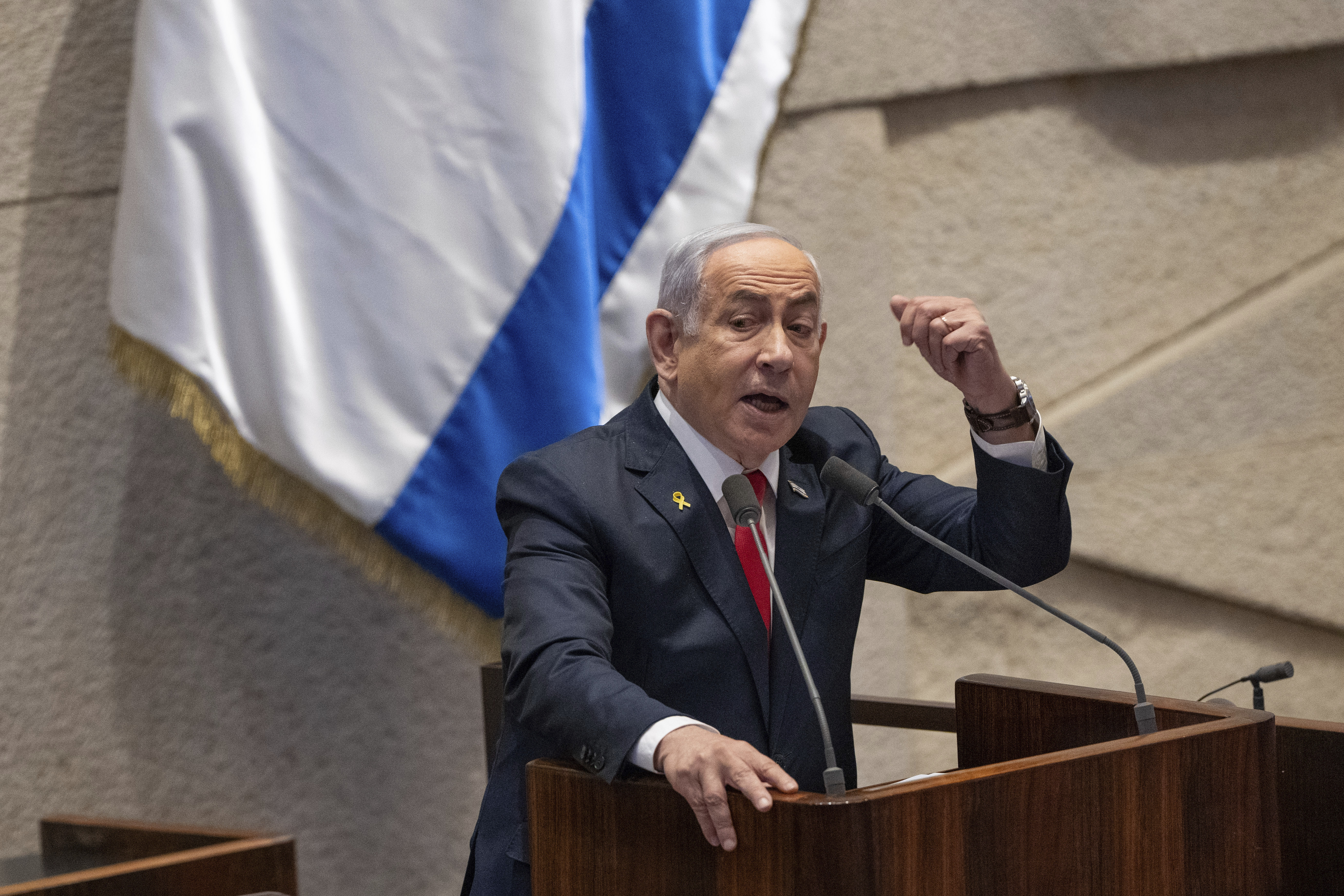 Israel's Prime Minister Benjamin Netanyahu addresses lawmakers in the Knesset, Israel's parliament, in Jerusalem. Monday Nov. 18, 2024. (AP Photo/Ohad Zwigenberg)