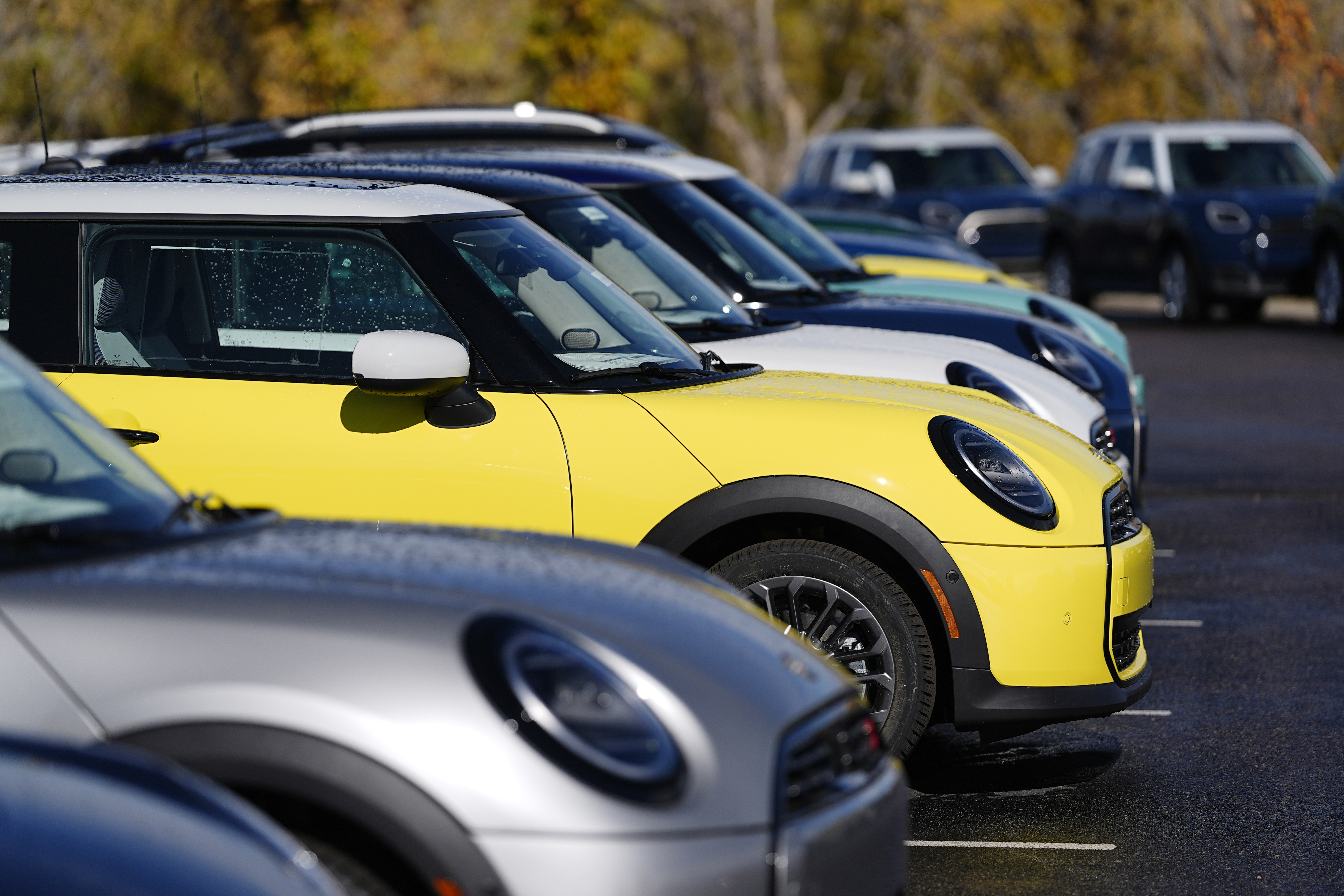 FILE - Unsold 2025 Cooper S hardtops are displayed at a Mini dealership on Oct. 21, 2024, in Highlands Ranch, Colo. (AP Photo/David Zalubowski, File)