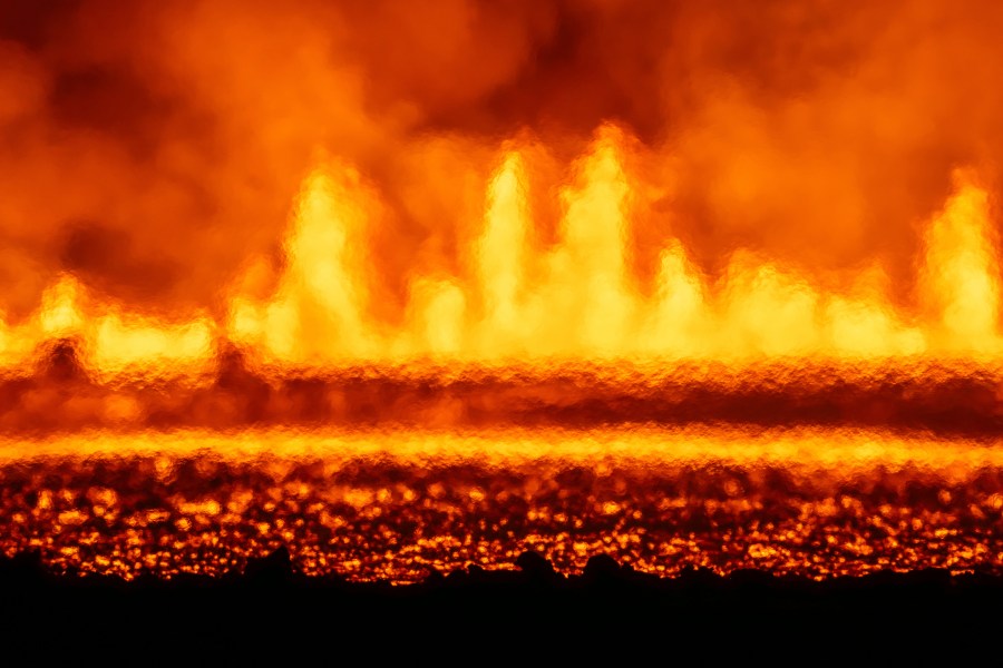 A new volcanic eruption that started on the Reykjanes Peninsula as seen from Grindavikurvegur, the road to Grindavik in Iceland, Wednesday, Nov.20, 2024. (AP Photo/Marco di Marco)