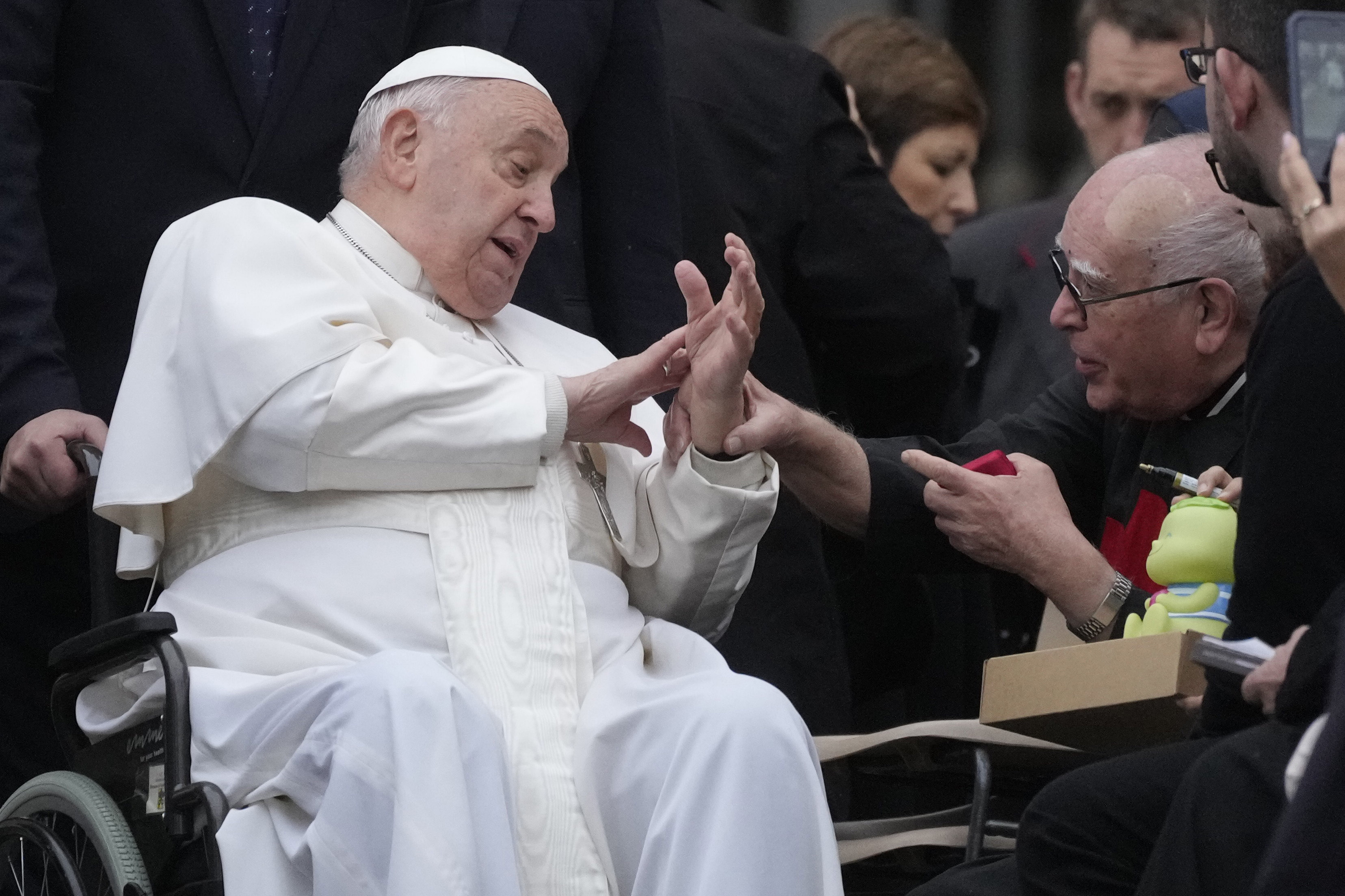 Pope Francis greets faithful during his weekly general audience in St. Peter's Square at The Vatican, Wednesday, Nov.20, 2024. (AP Photo/Gregorio Borgia)