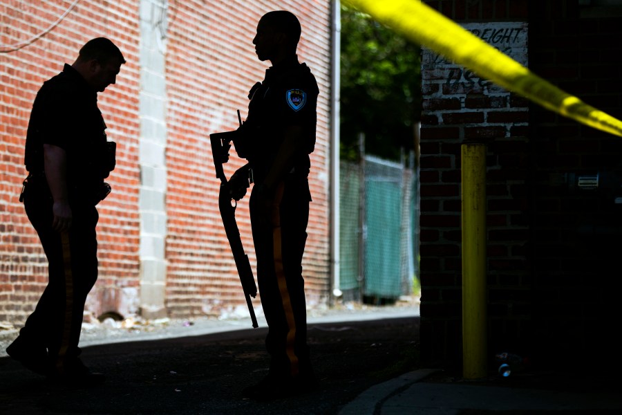 FILE - Police stand guard at the perimeter of a standoff with a man in a home in Trenton, N.J., Wednesday, May 10, 2017. (AP Photo/Matt Rourke, File)