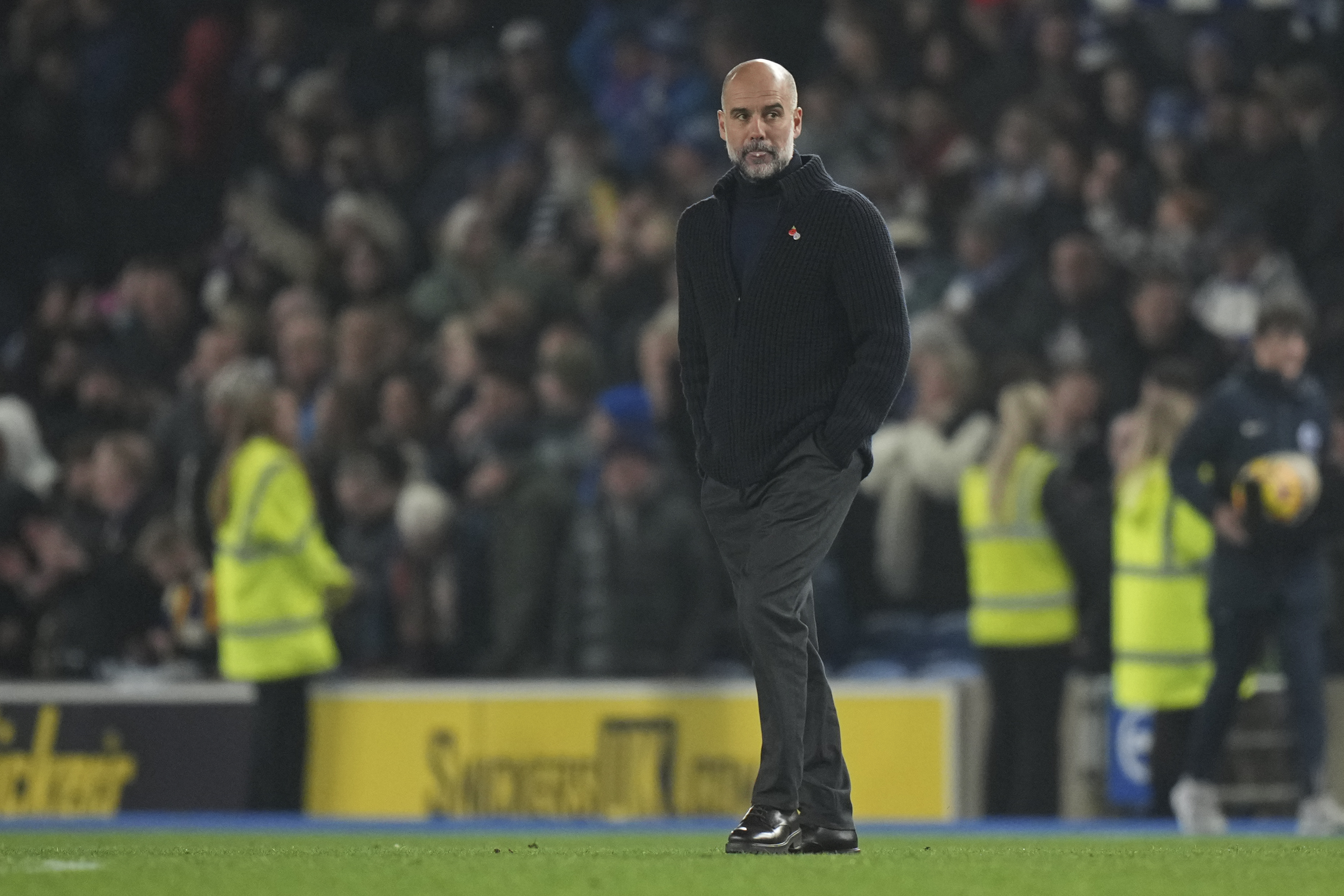 Manchester City's head coach Pep Guardiola leaves the pitch after the English Premier League soccer match between Brighton and Manchester City at Falmer Stadium in Brighton, England, Saturday, Nov. 9, 2024. (AP Photo/Alastair Grant)