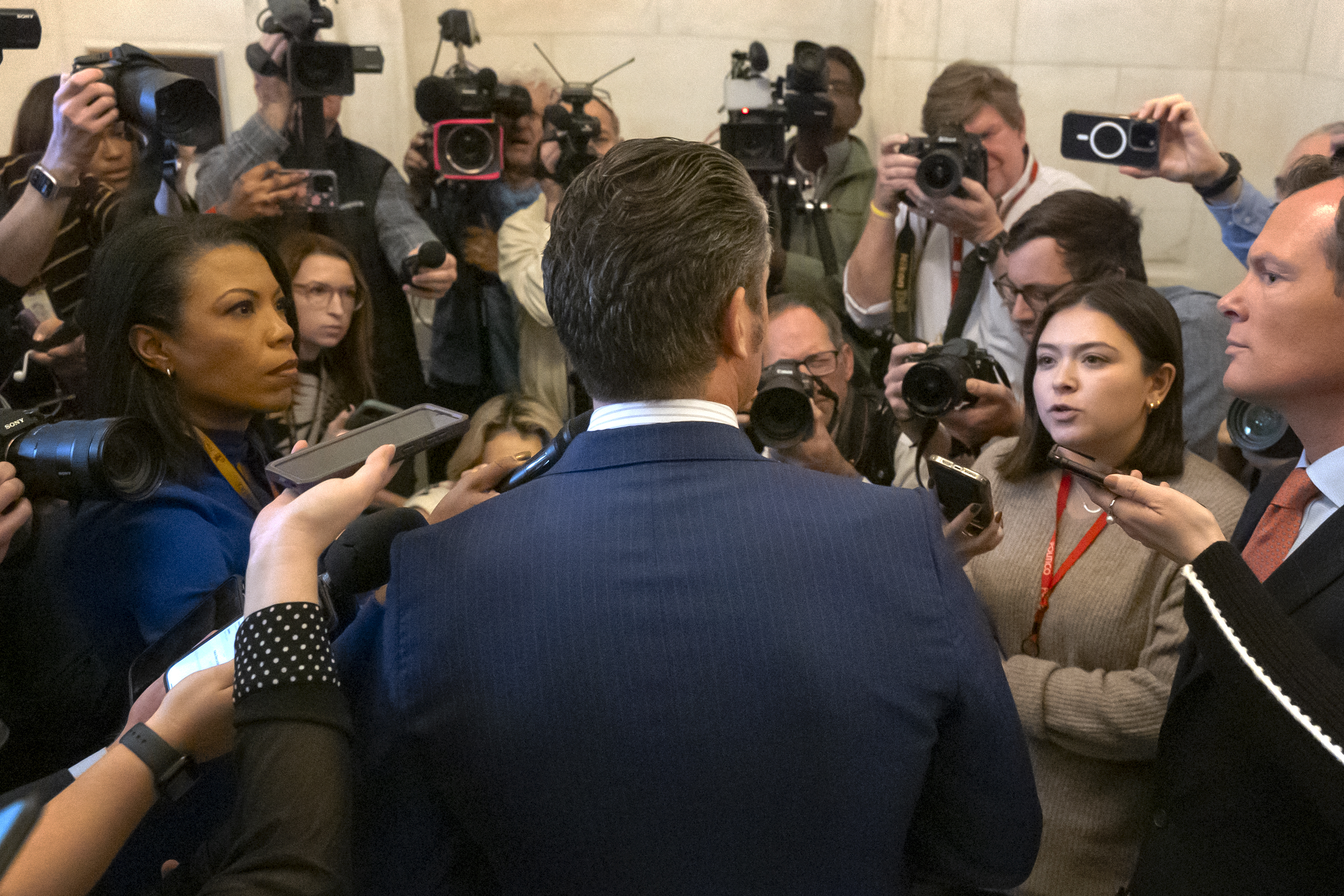 Pete Hegseth, President-elect Donald Trump's pick for Secretary of Defense, speaks with reporters after meeting with senators on Capitol Hill, Thursday, Nov. 21, 2024, in Washington. (AP Photo/Mark Schiefelbein)