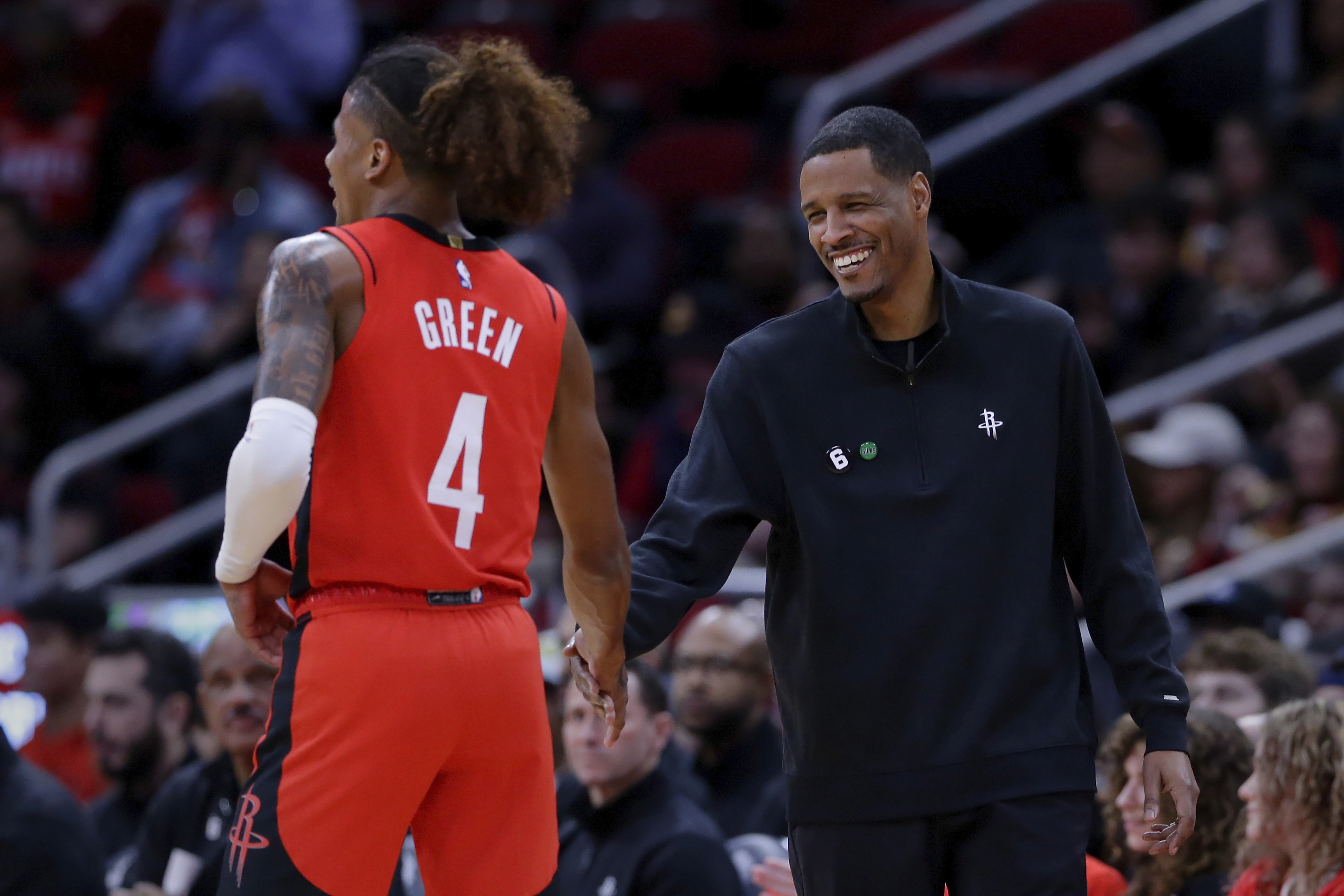 FILE - Houston Rockets guard Jalen Green (4) and head coach Stephen Silas shake hands after a score and a foul by Green against the New York Knicks during the first half of an NBA basketball game Saturday, Dec. 31, 2022, in Houston. (AP Photo/Michael Wyke, File)