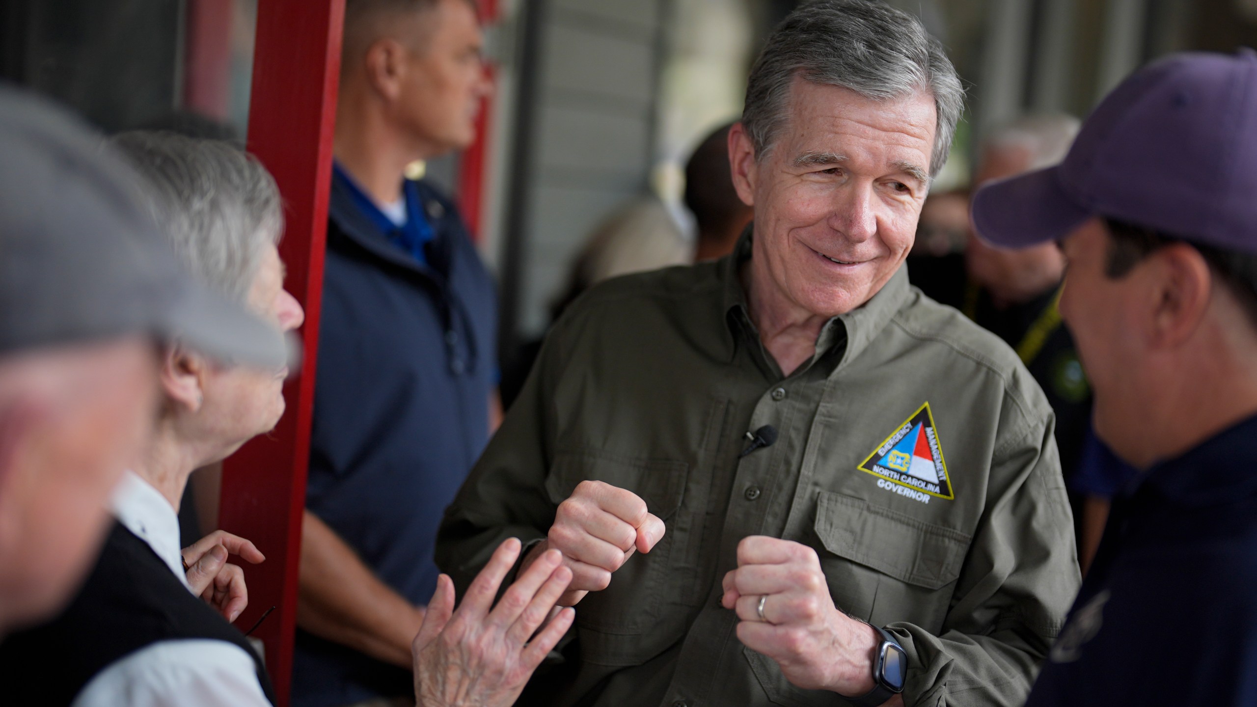 FILE - North Carolina Gov. Roy Cooper greets people, Oct. 3, 2024, in Boone, N.C., in the aftermath of hurricane Helene. (AP Photo/Chris Carlson, File)