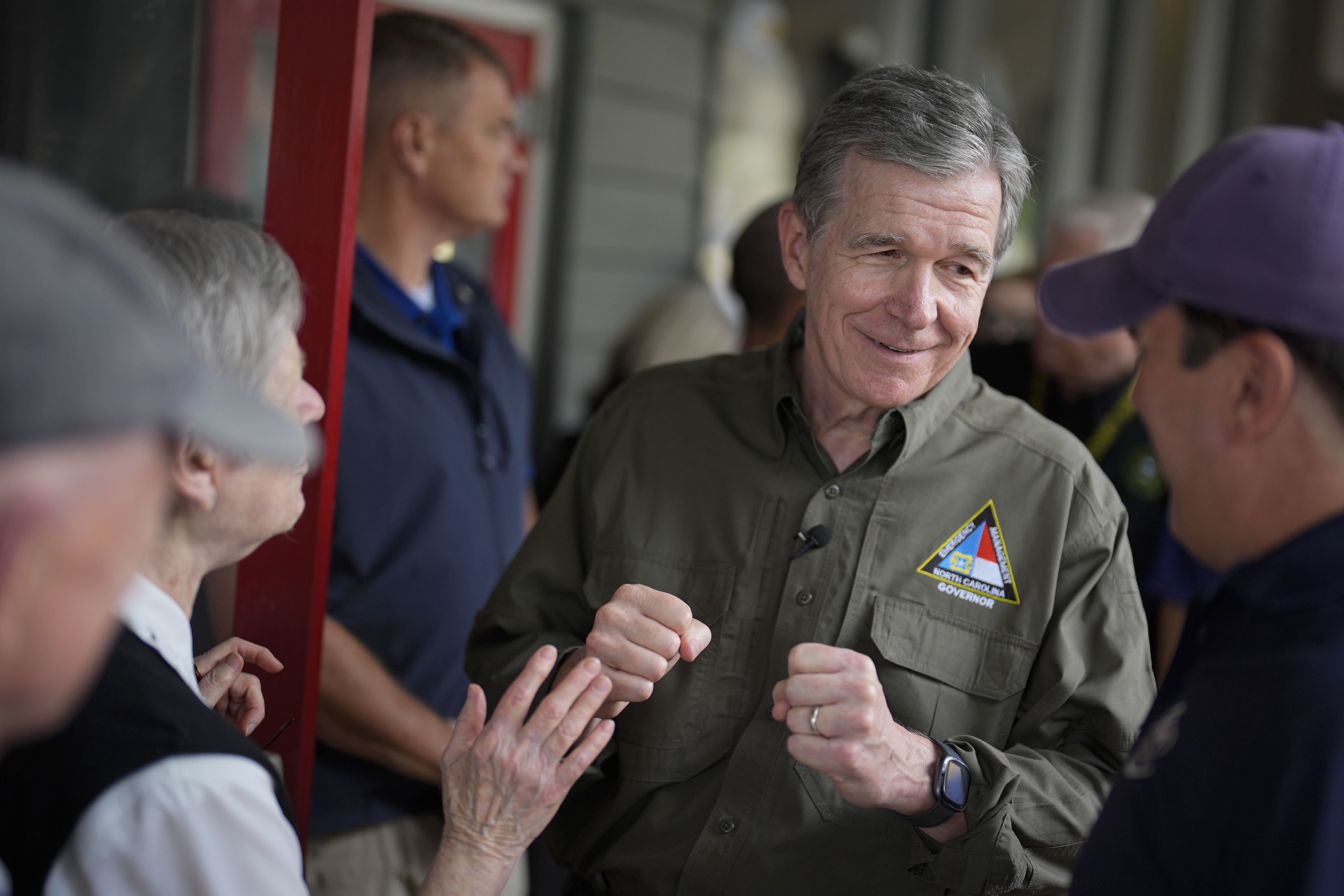 FILE - North Carolina Gov. Roy Cooper greets people, Oct. 3, 2024, in Boone, N.C., in the aftermath of hurricane Helene. (AP Photo/Chris Carlson, File)